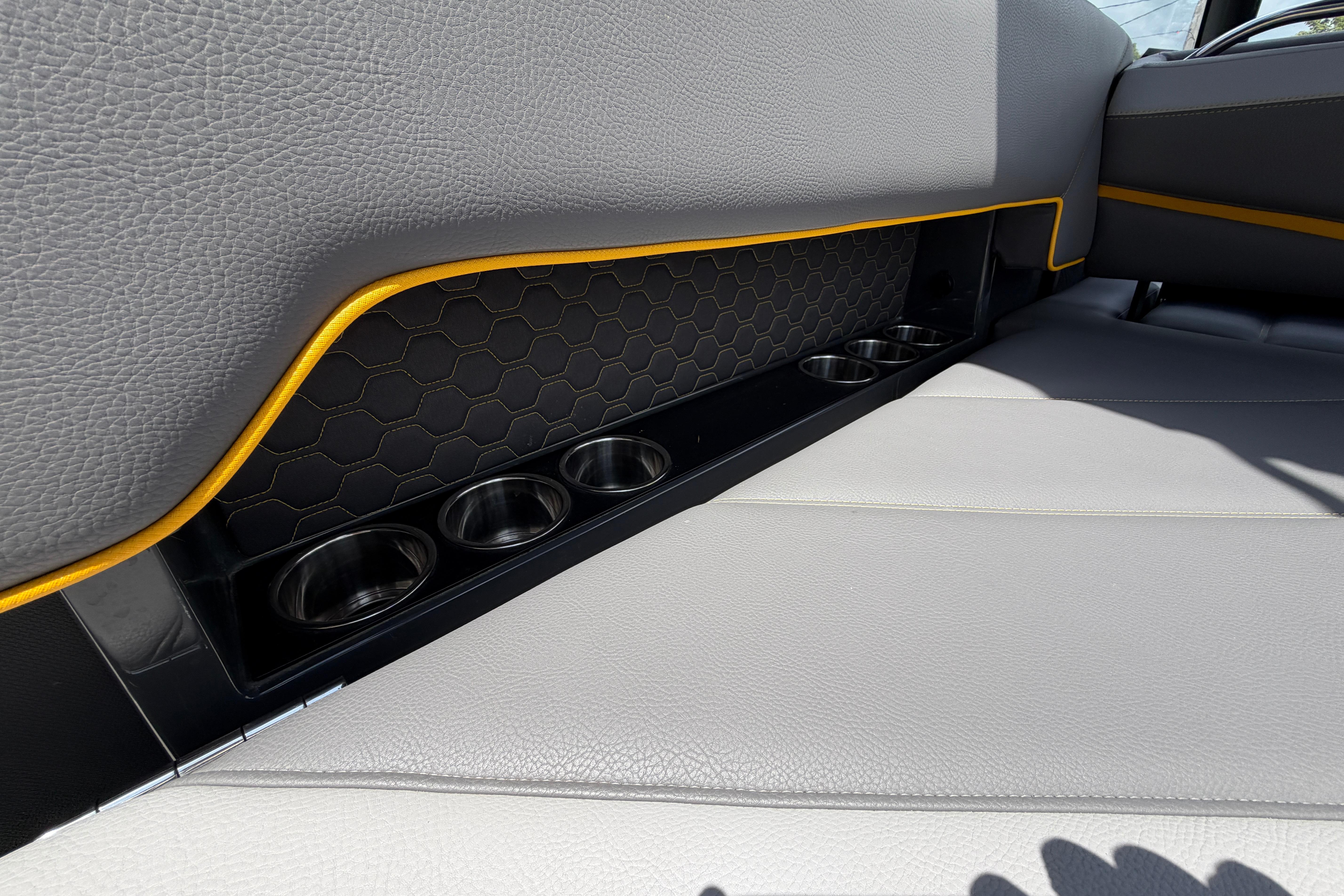 2021 Cobalt R8 Surf interior with gray leather seats and cup holders.