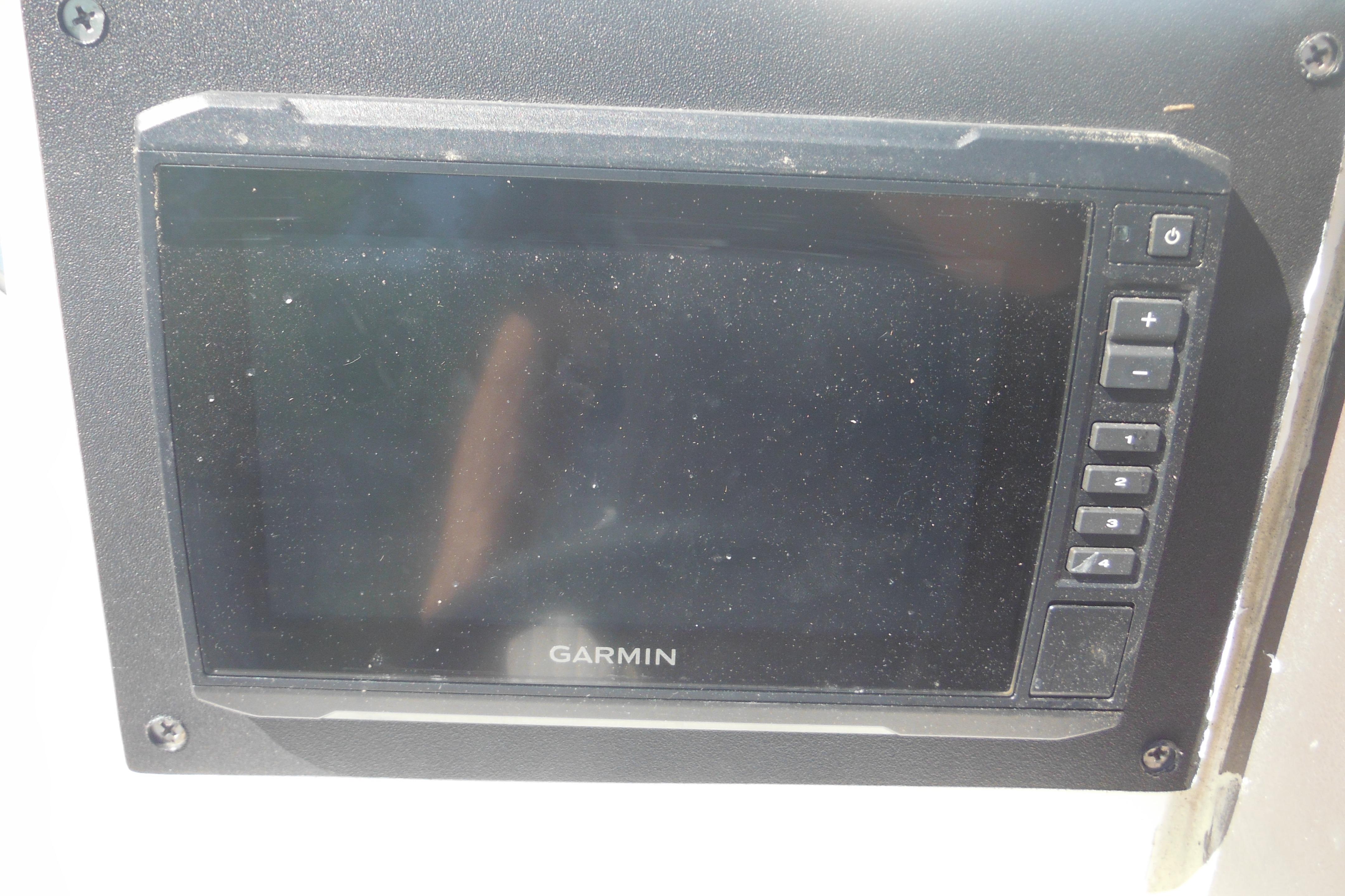 Garmin marine GPS device on 2009 Boston Whaler 200 Dauntless boat dashboard.