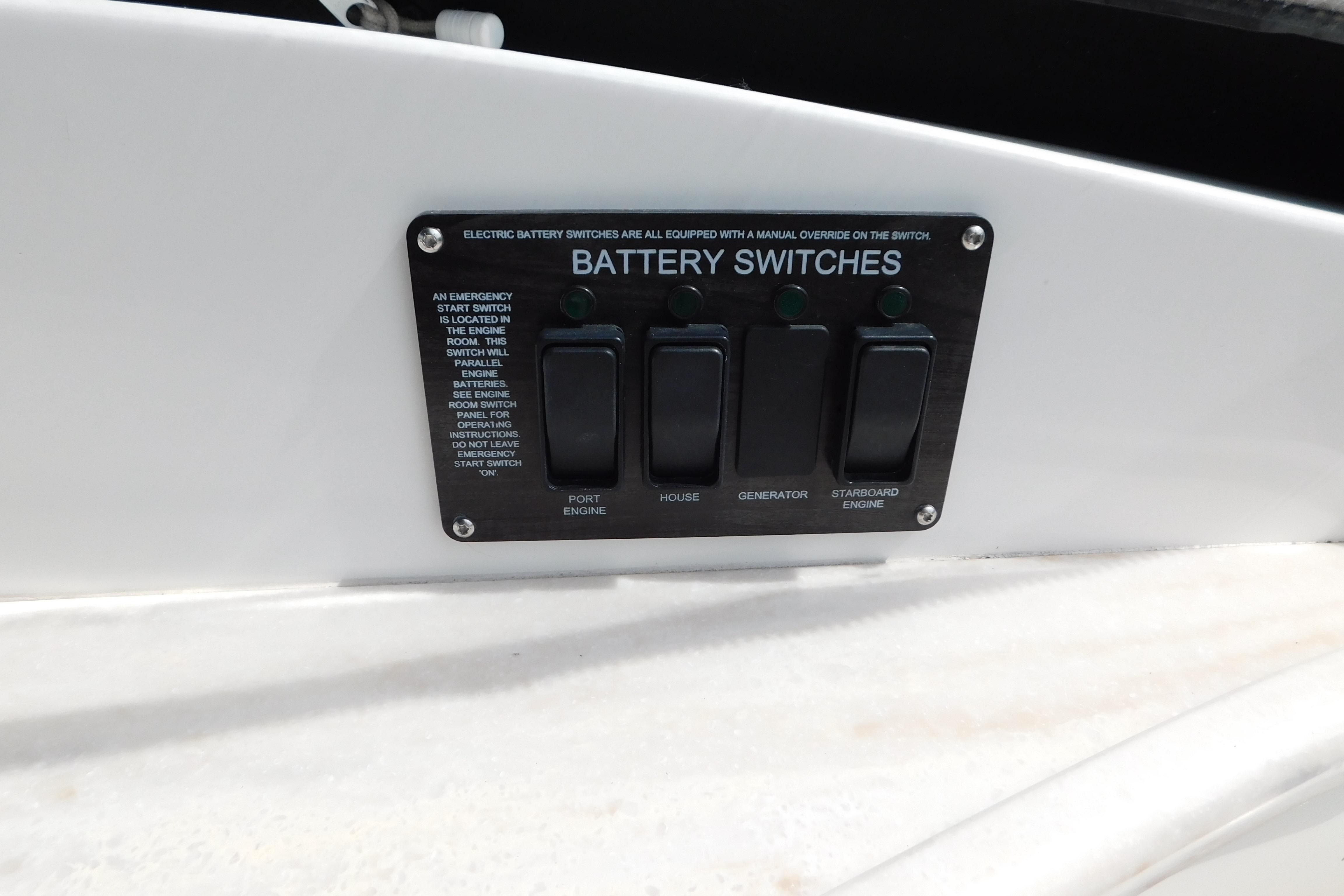 Battery switches panel on 2017 Rinker EX 320 boat, featuring engine and generator controls.