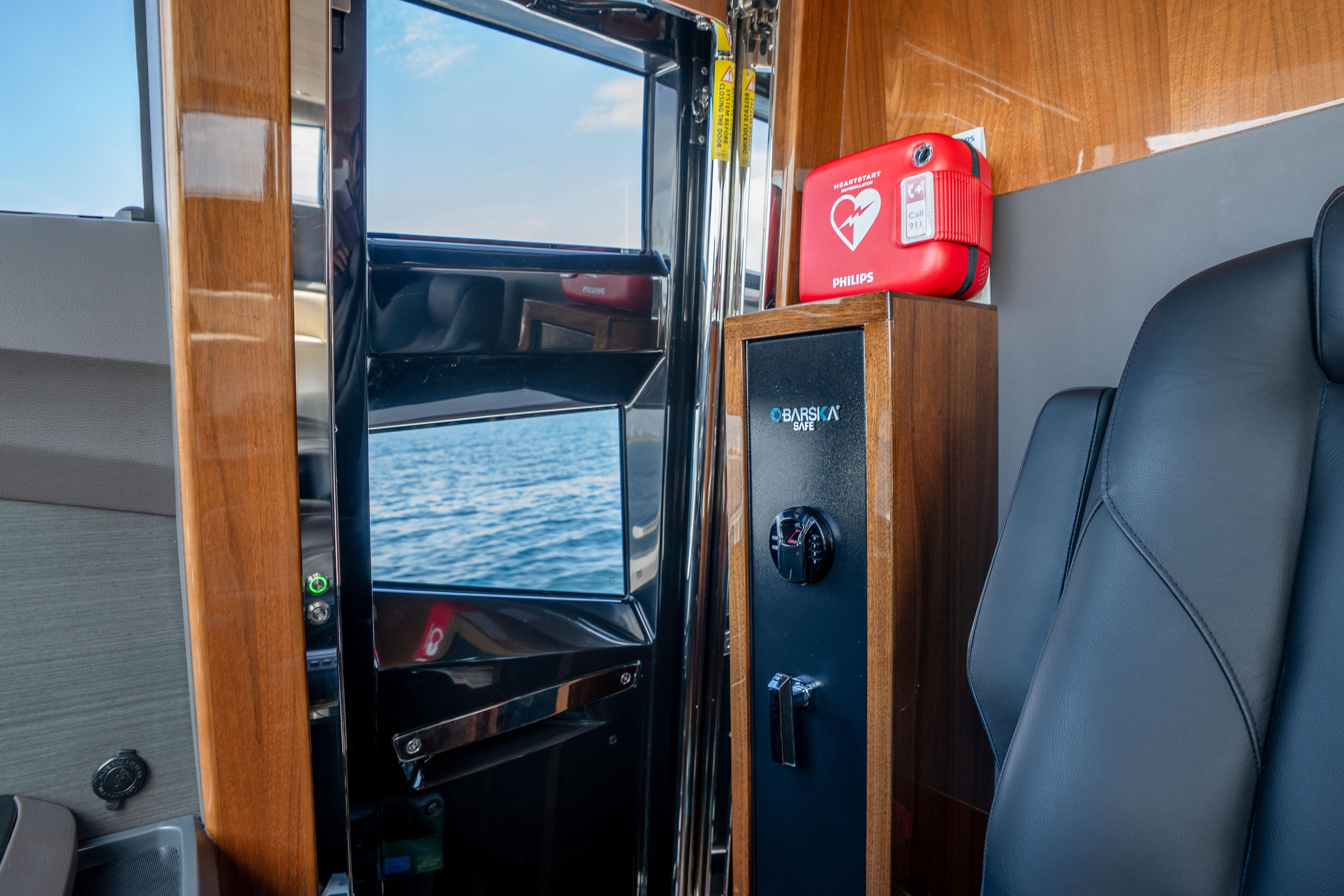 Interior of 2020 Princess Y85 yacht with safe and first aid kit.