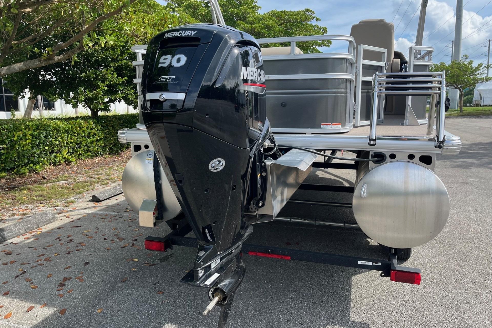 2025 Sun Tracker Fishin' Barge 20 DLX with Mercury 90 outboard motor.