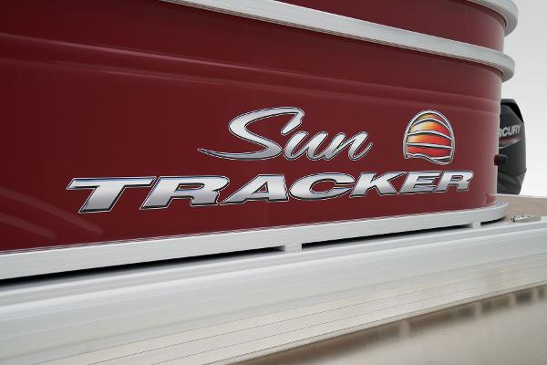 2024 Sun Tracker Party Barge 20 DLX logo on red boat exterior.