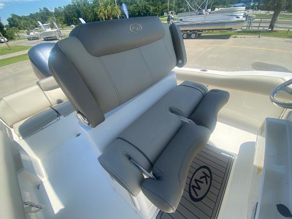 2024 Key West 239 FS boat interior with gray seating and KW logo.