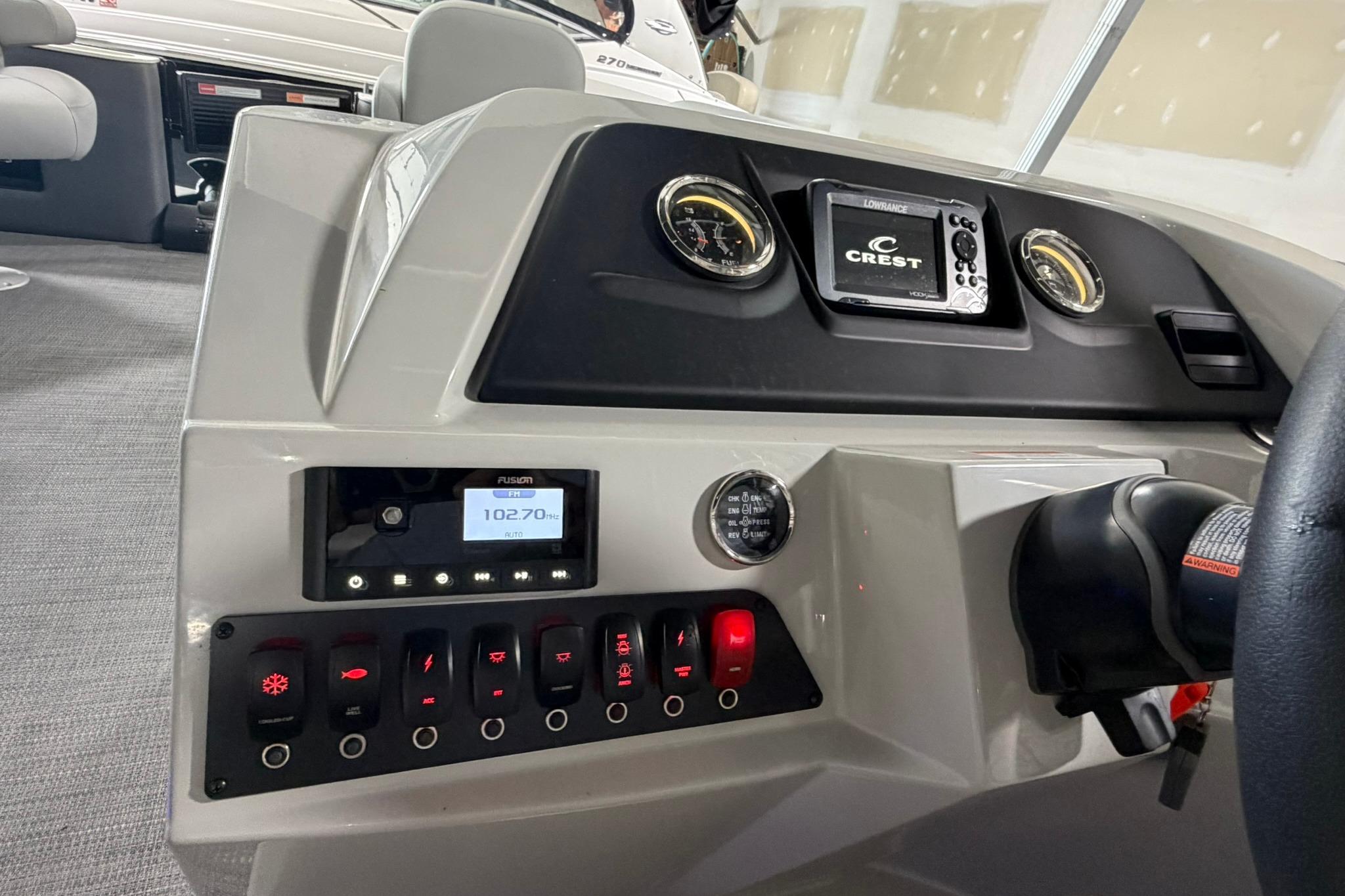 Dashboard of 2023 Crest Classic LX 200 boat with control panel and gauges.