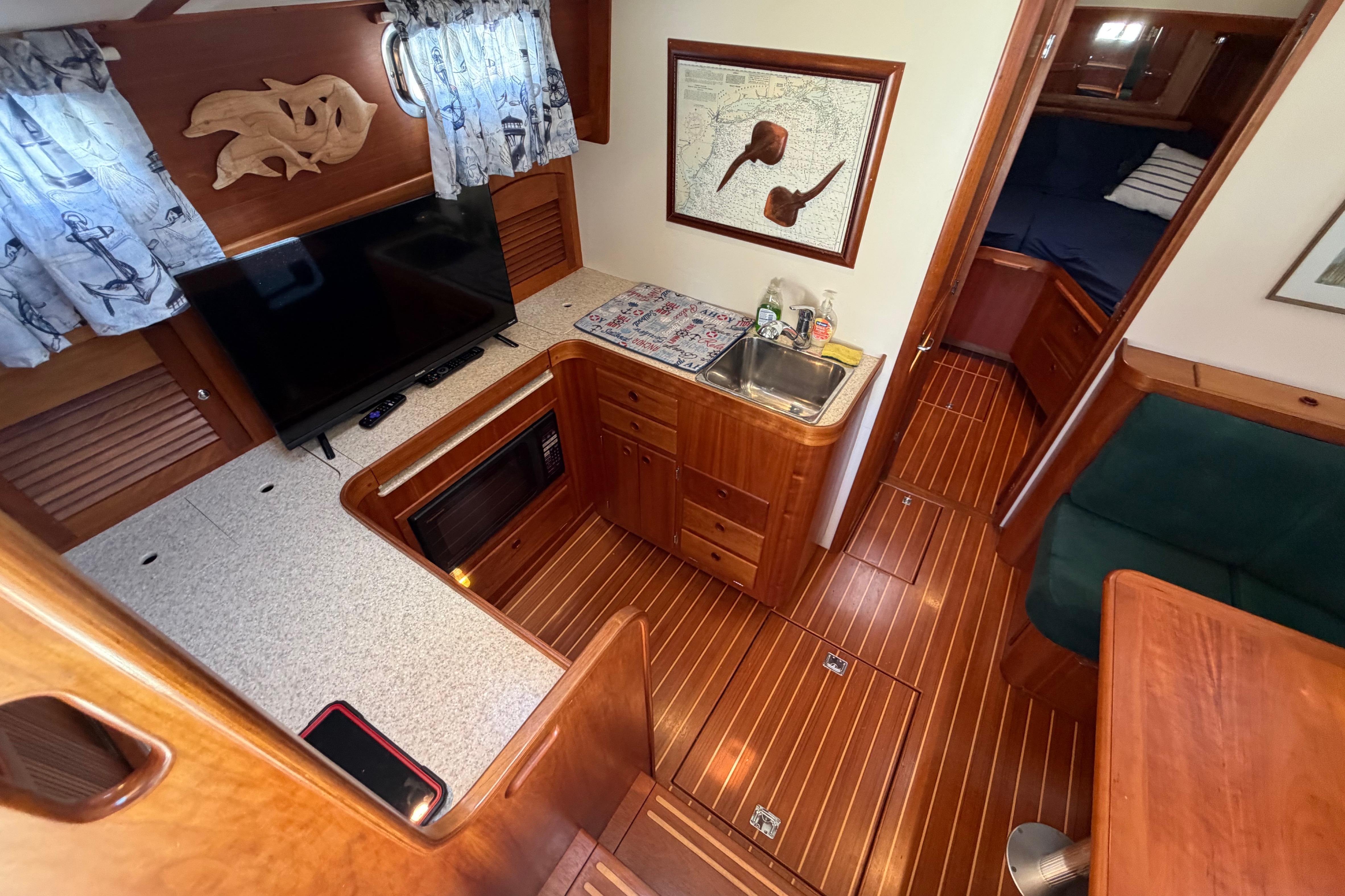 Interior of 2000 Sabreline 36 Express yacht with wood finish and modern amenities.
