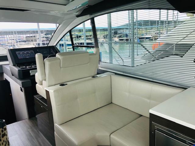 Interior of 2019 Cruisers Yachts 50 Cantius with luxurious seating area.