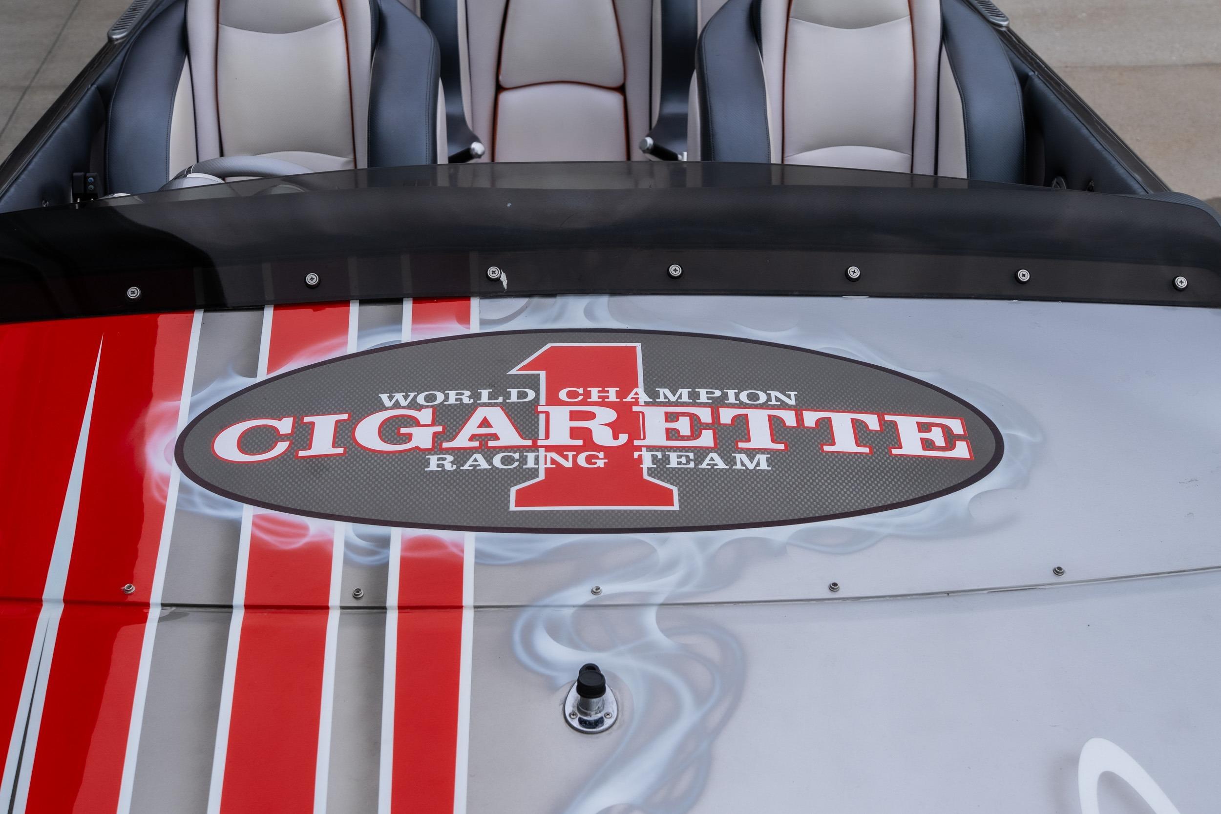 2006 Cigarette 39' Top Gun Unlimited boat with racing team logo on deck.