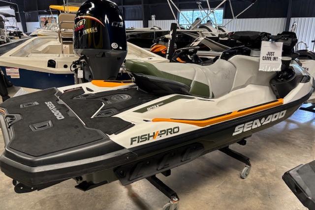 2020 Sea-Doo FISH PRO jet ski displayed indoors, featuring sleek design and Yamaha engine.