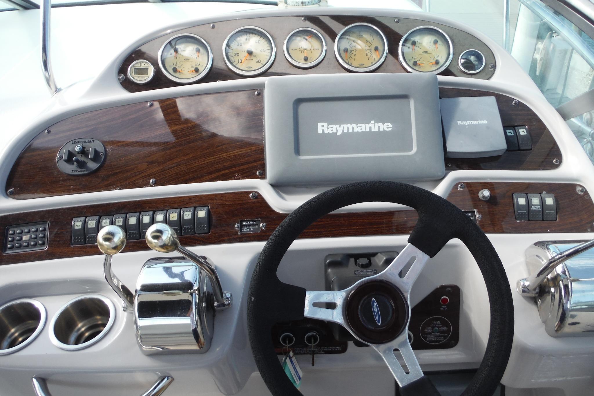 Helm of 2005 Chaparral Signature 350 with Raymarine navigation system and classic gauges.