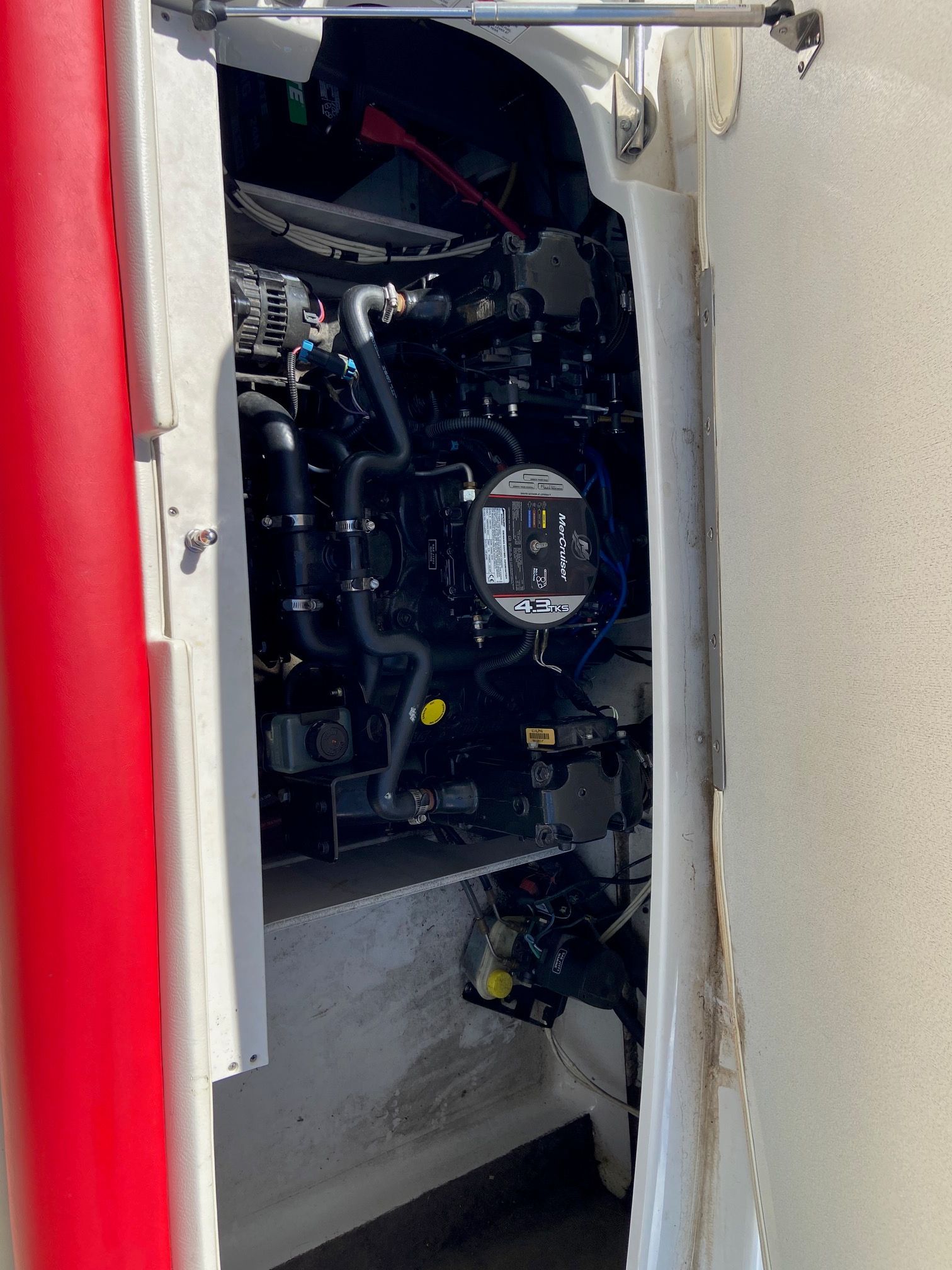 Engine compartment of a 2011 Crownline 21 SS boat with visible engine.
