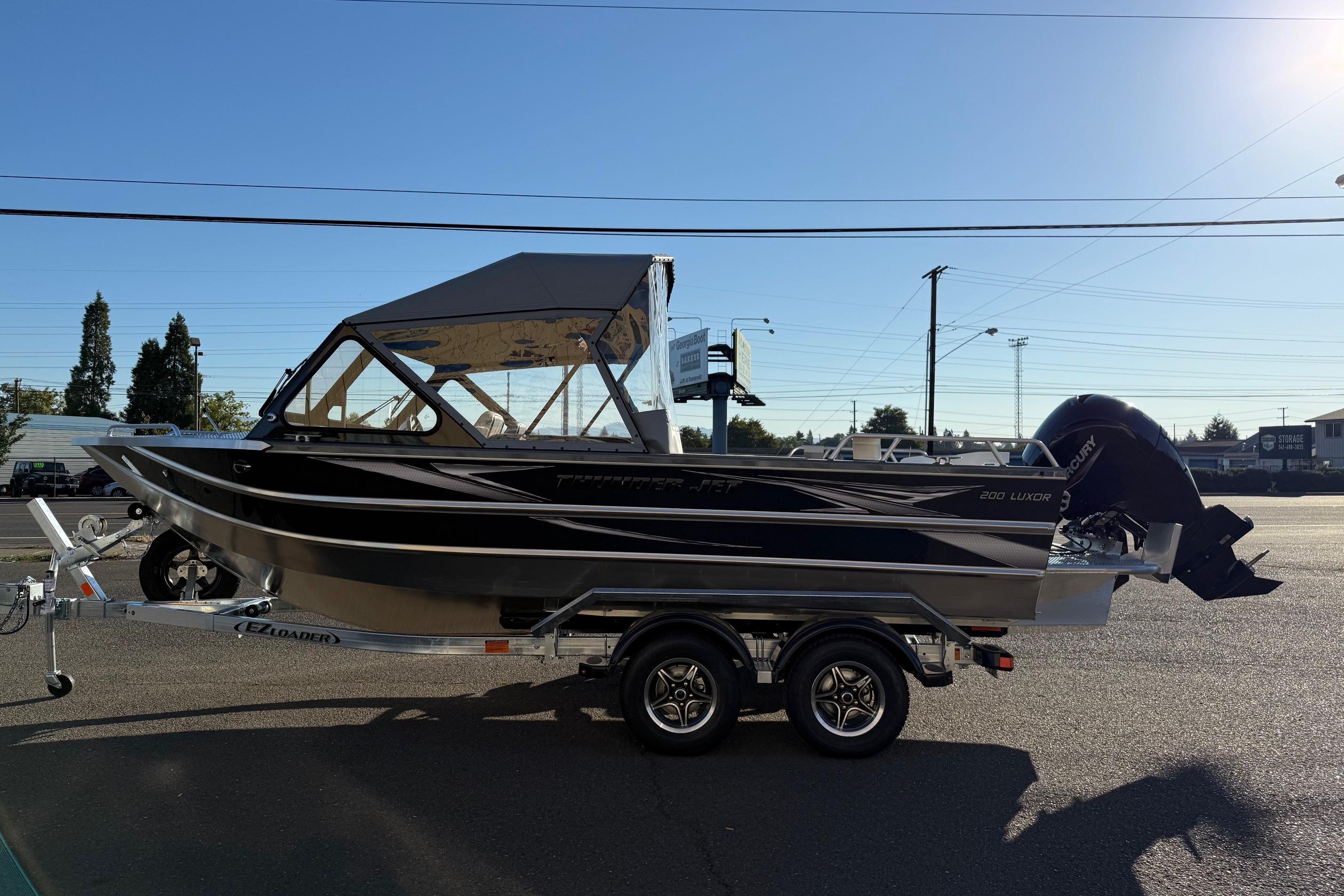 2026 Thunder Jet 200 Luxor boat on trailer, parked outdoors under clear sky.