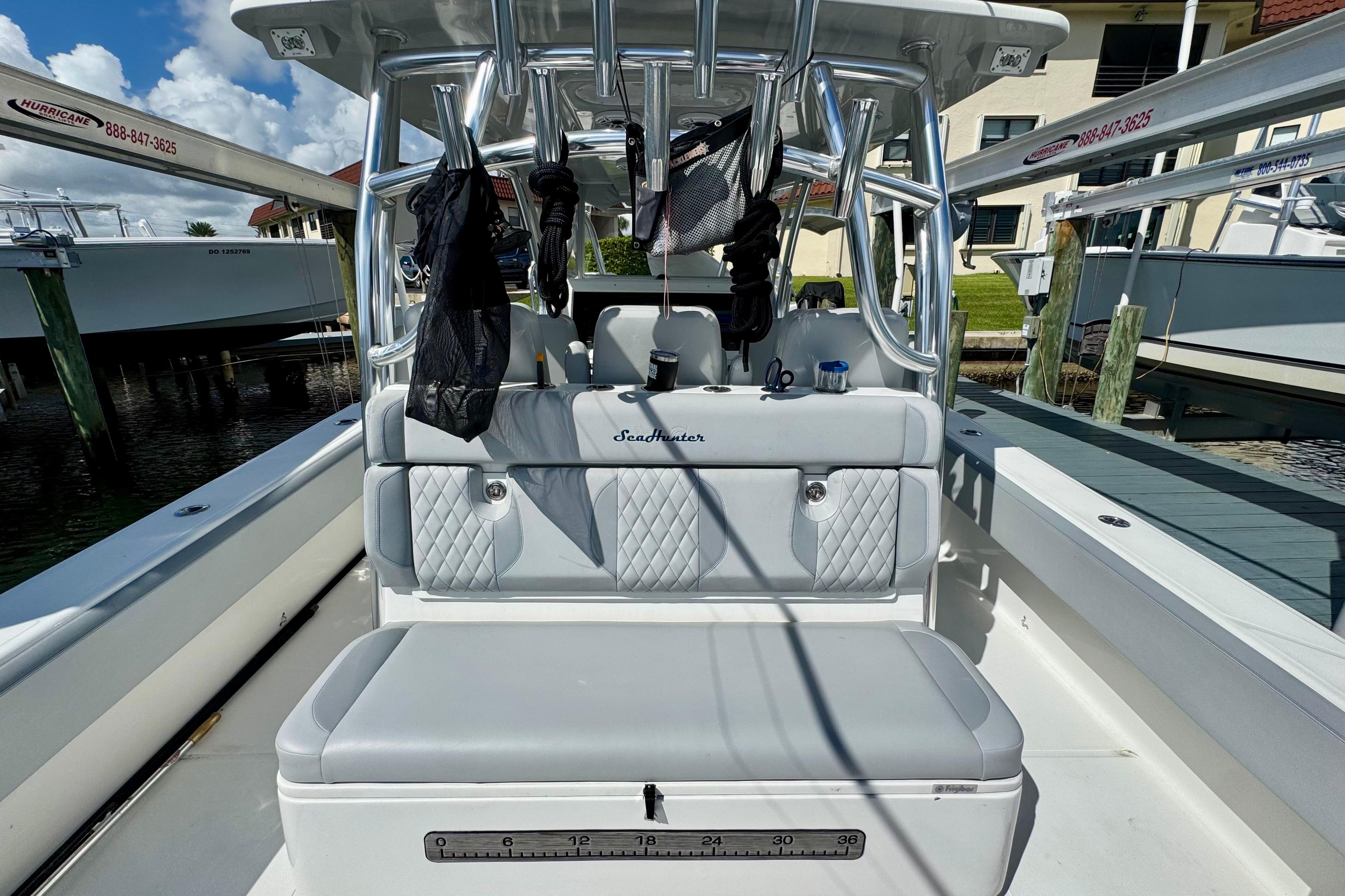 2021 SeaHunter 41 CTS boat interior with cushioned seating and rod holders.