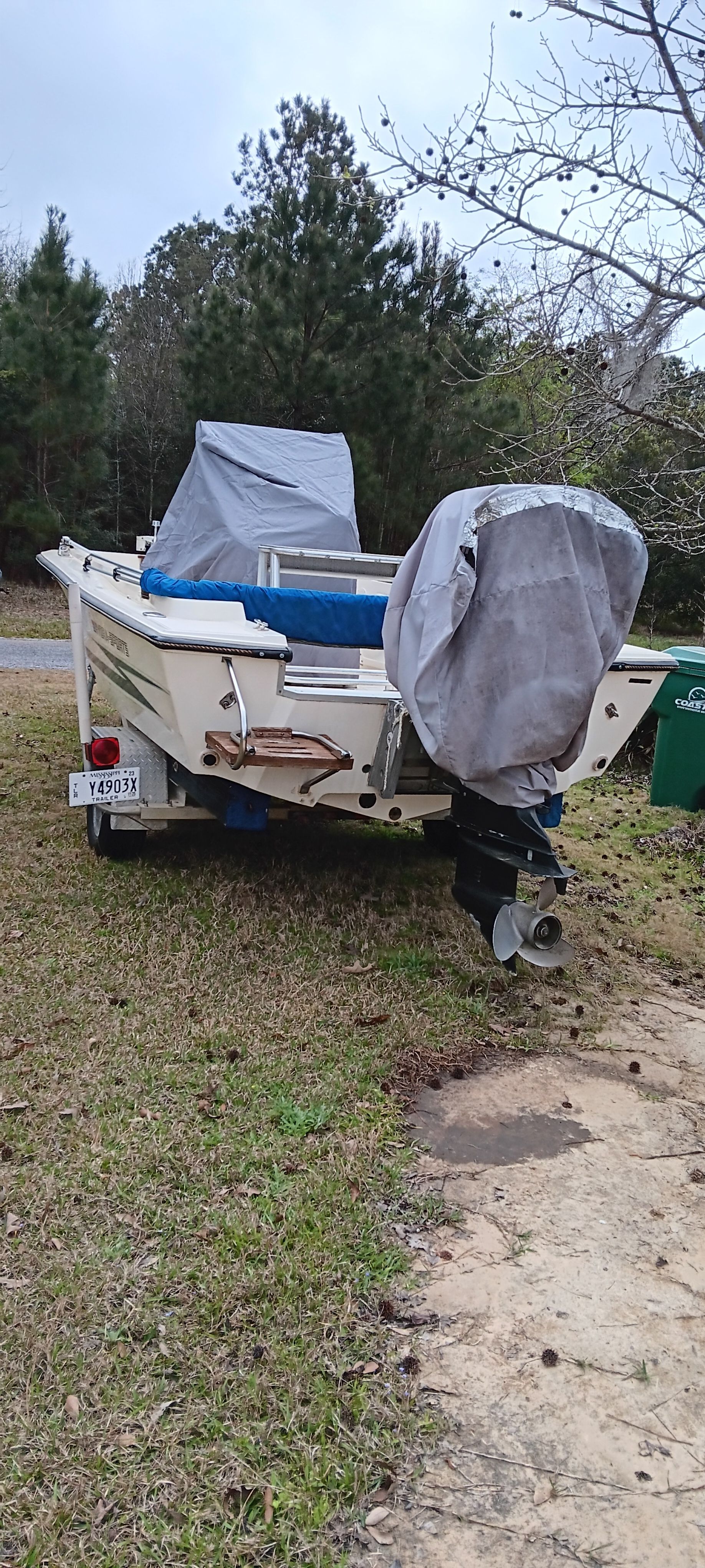 A 1990 Hydra-Sports Vector on grass. The motor is covered for protection.