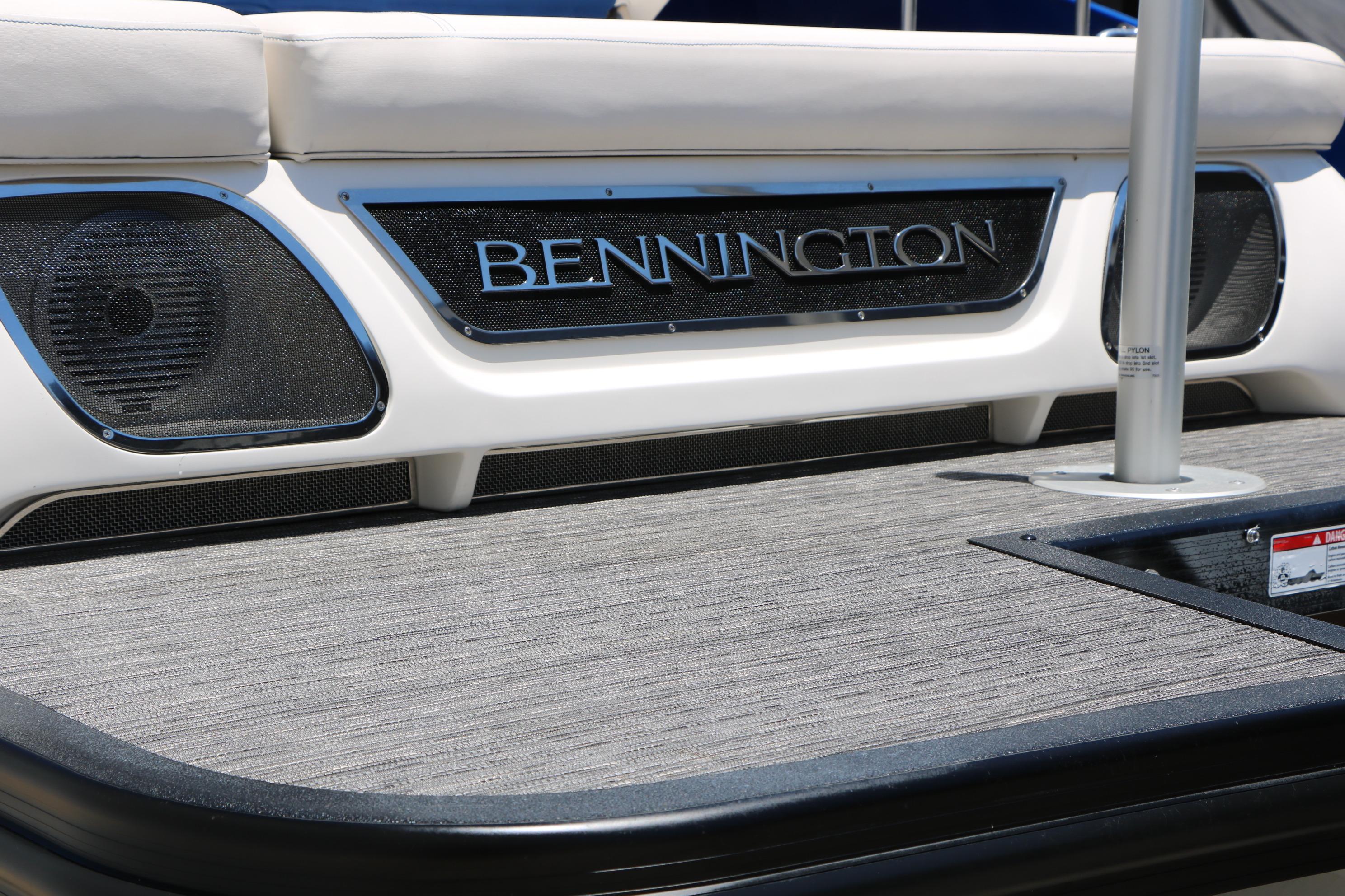 2024 Bennington 23 RX Swingback boat deck with logo and speakers.
