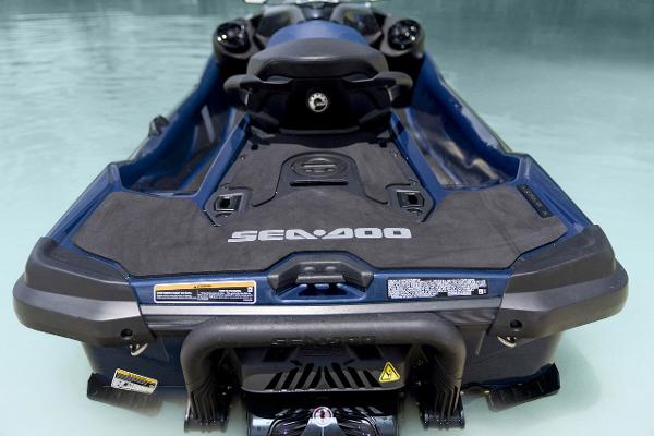 Manufacturer Provided Image: 2026 Sea-Doo GTX 230 jet ski in water, rear view, showcasing sleek design.