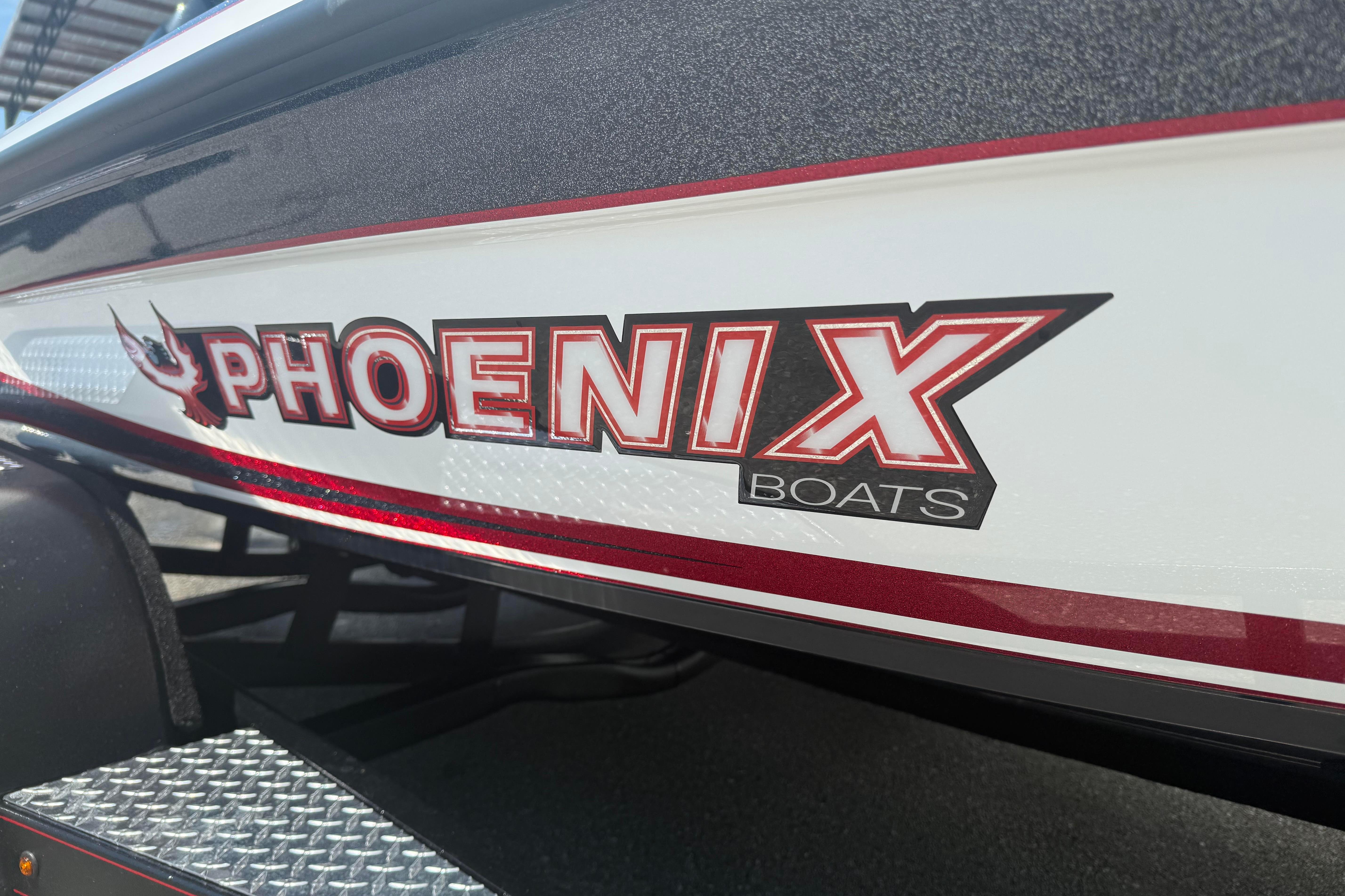 Phoenix 819 ZXL 2027 boat logo with red and black design on white surface.