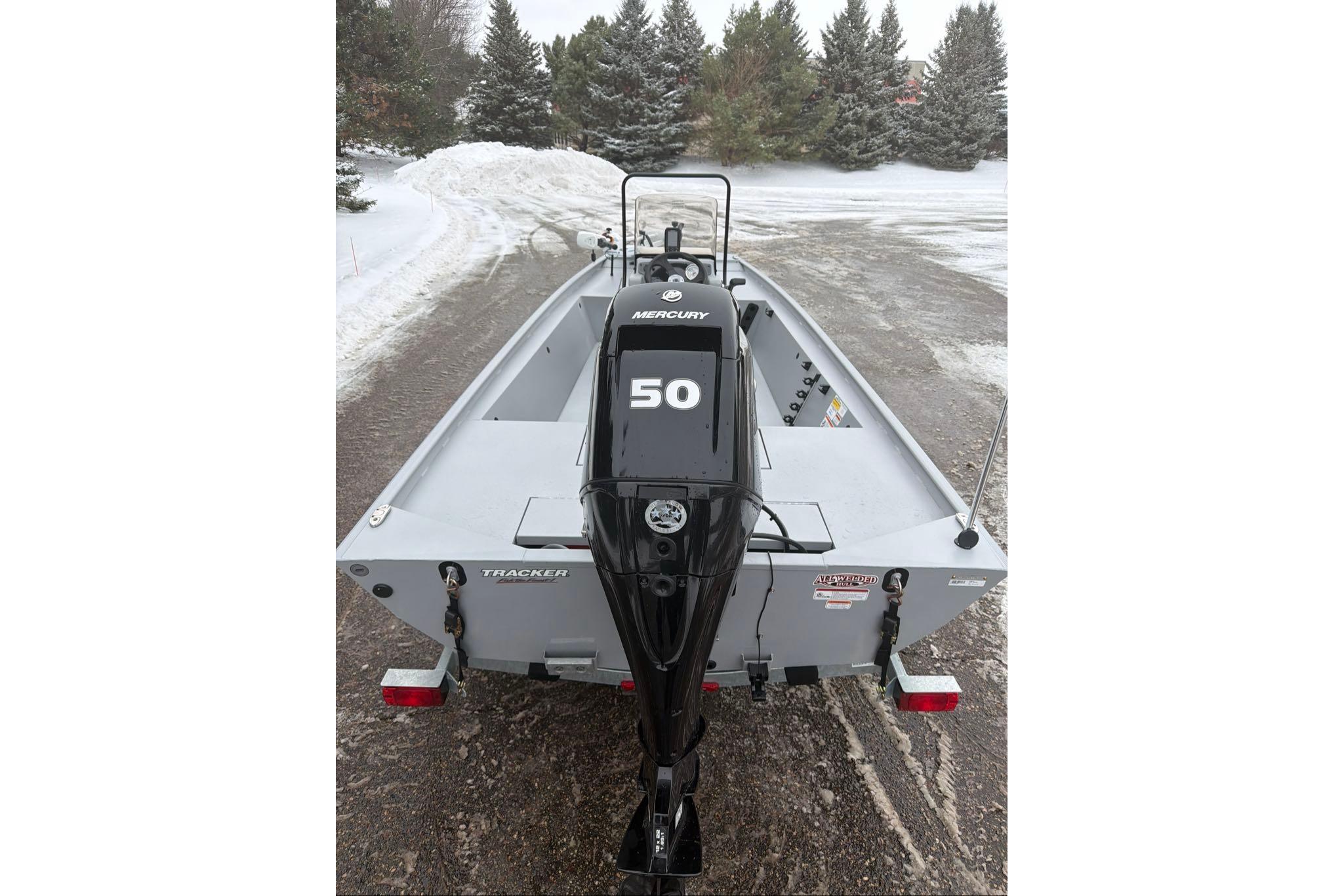 2026 Tracker Bass Tracker Classic CC boat with Mercury 50 engine in snowy setting.