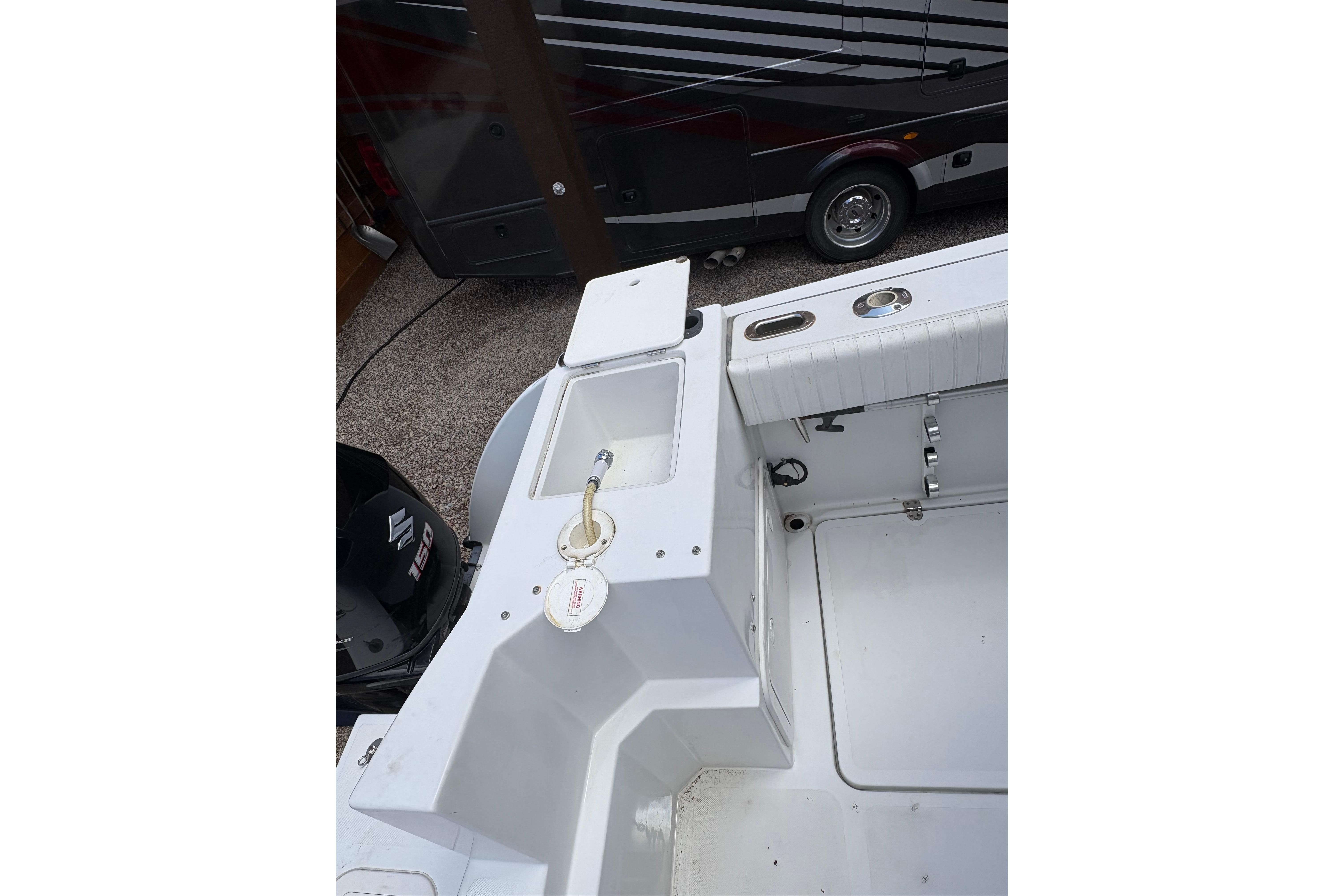 2001 Glacier Bay 2690 Coastal Runner boat interior with fishing rod holders.