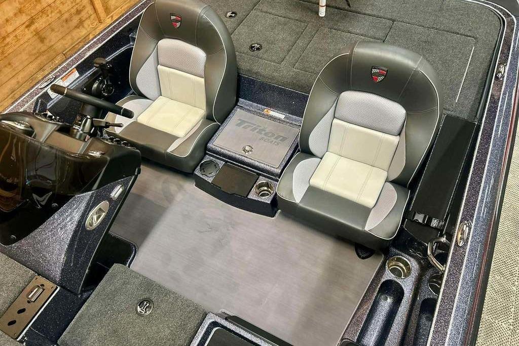 2026 Triton 18 TrX boat interior with dual seats and steering console.