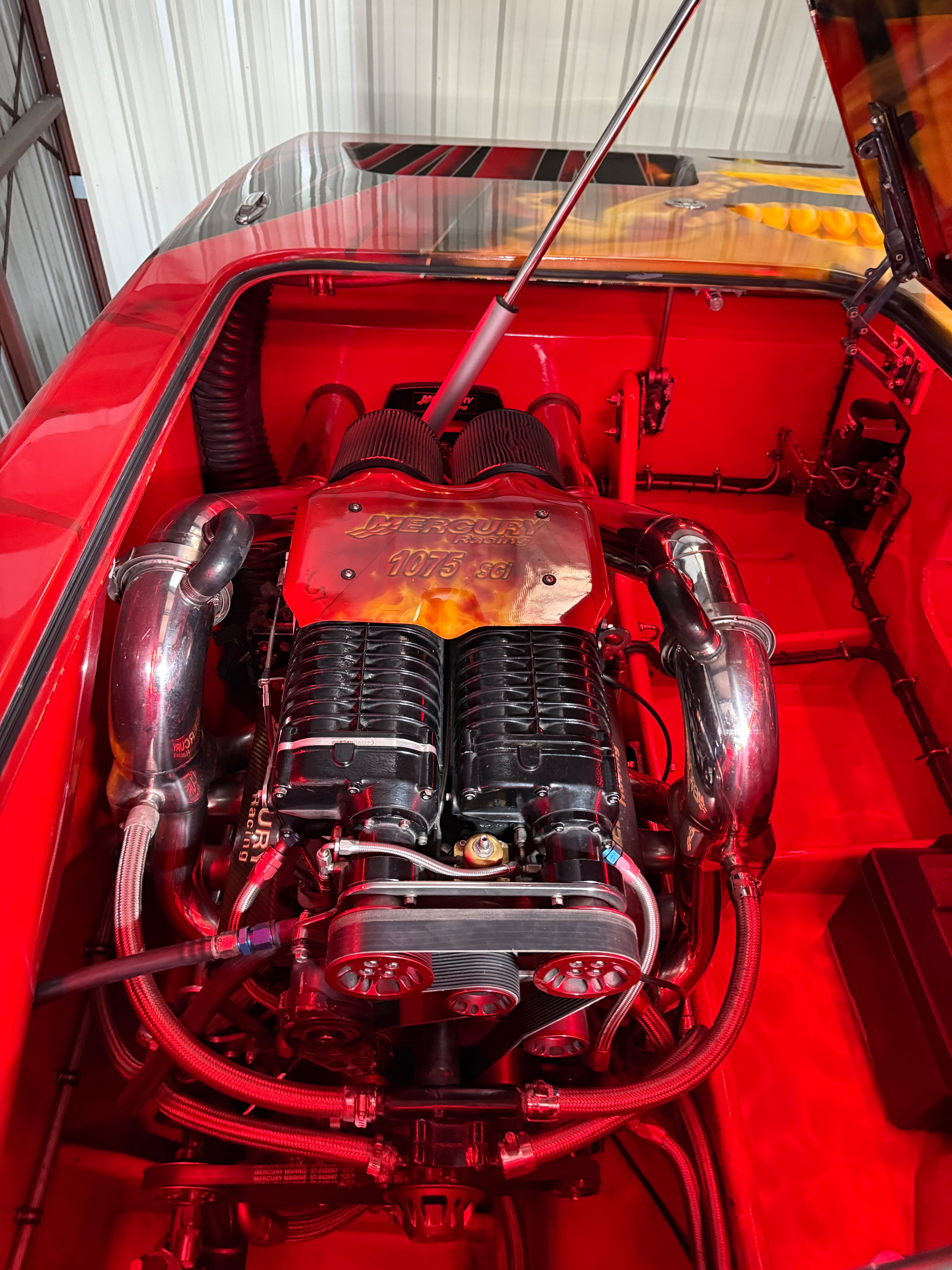 The 2010 MTI CAT features a powerful engine with shiny metal components in a red engine compartment.