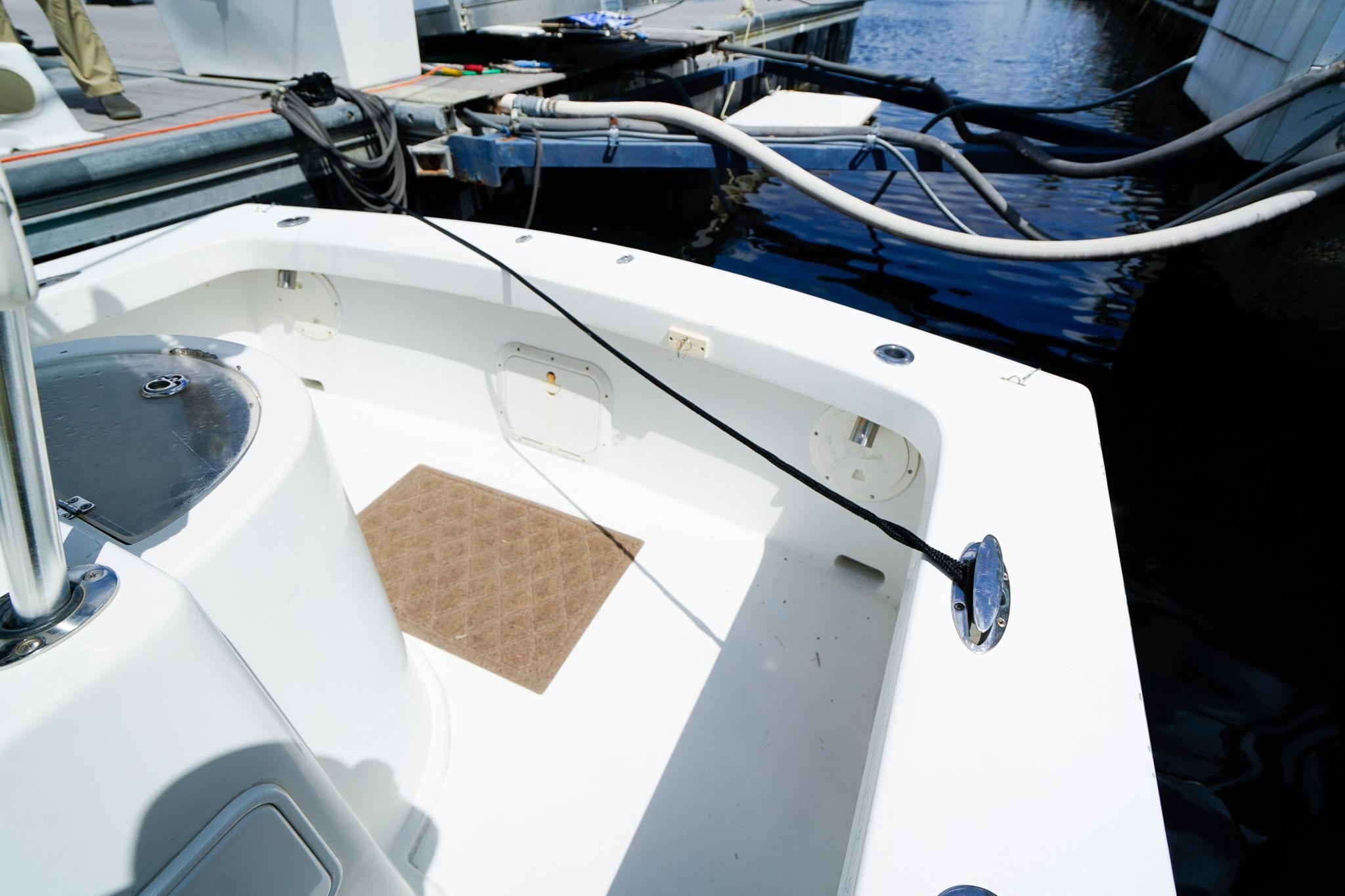1977 Scarborough 27 CC boat interior at dock, featuring clean white deck.