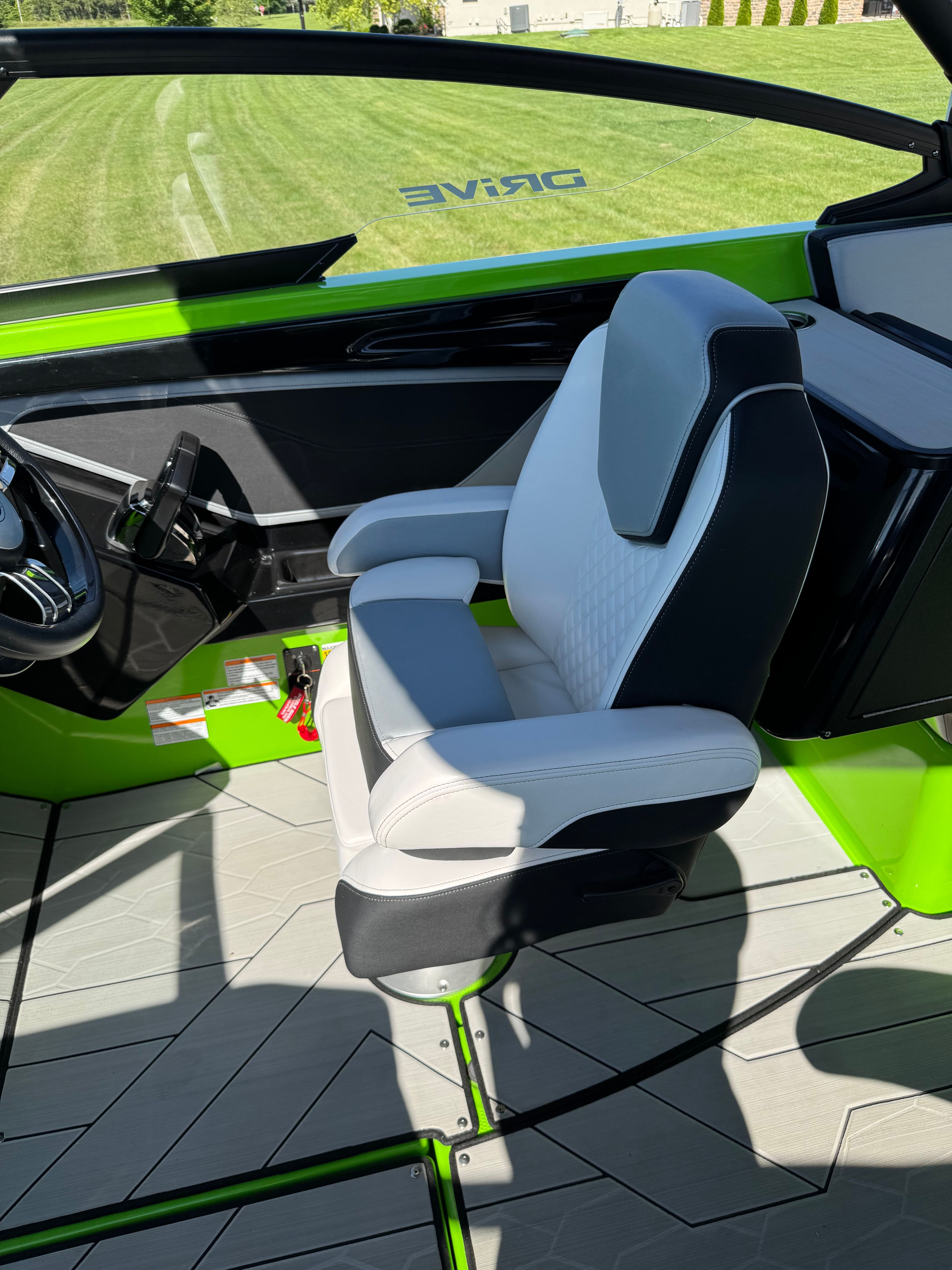 Interior of a 2022 Yamaha Boats 255XD with green and gray design.