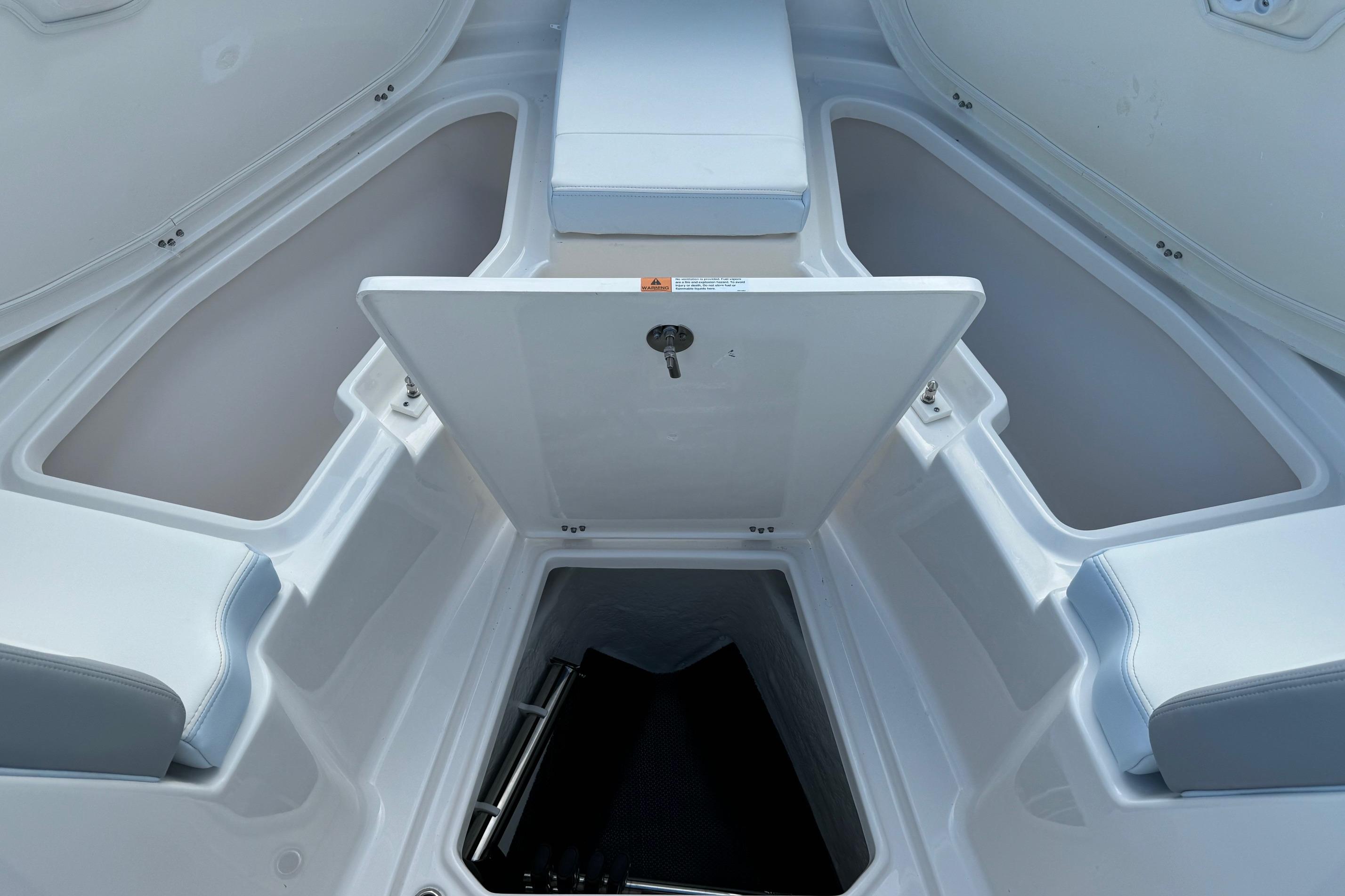2025 Robalo R360 Center Console boat interior with open storage compartments.