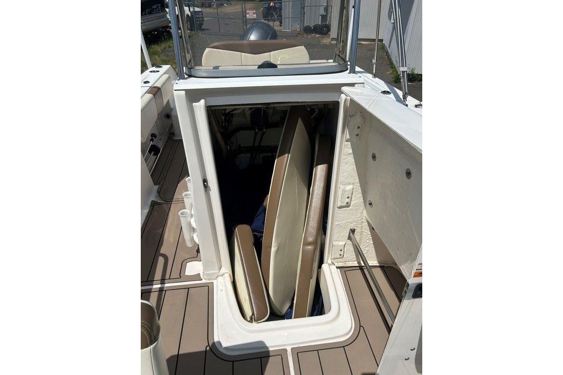 2017 Robalo R200ES boat storage compartment with cushions inside.