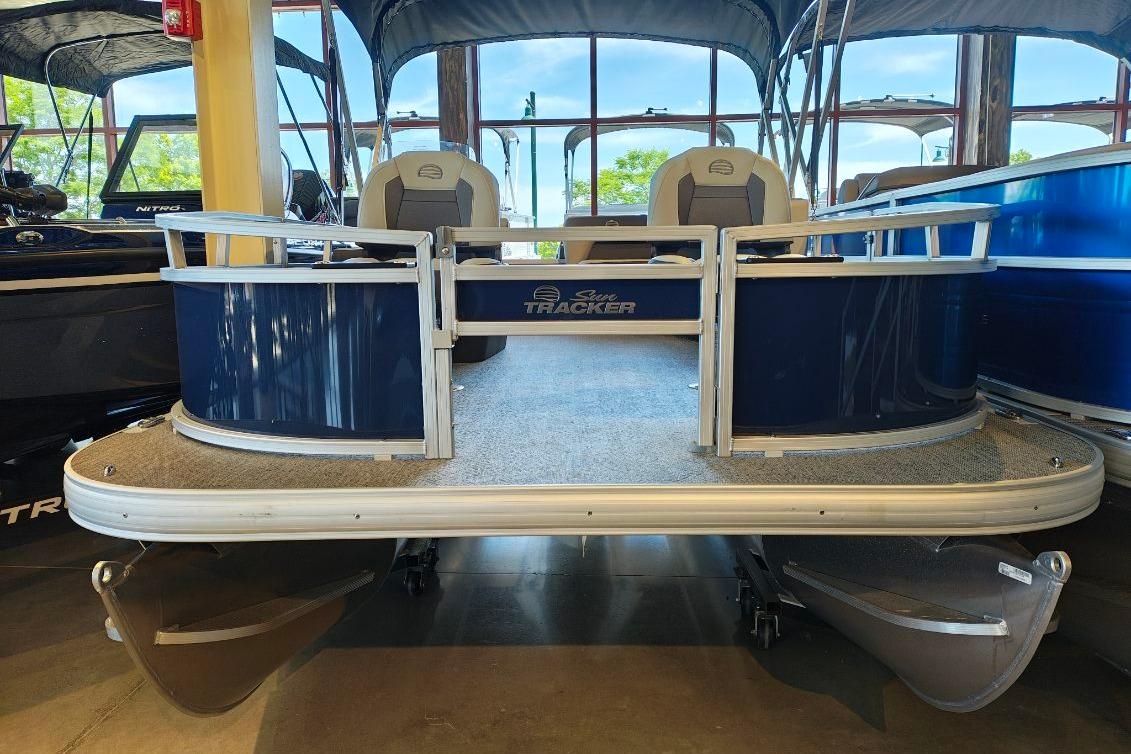 2026 Sun Tracker Bass Buggy 16 XL Select pontoon boat in showroom.