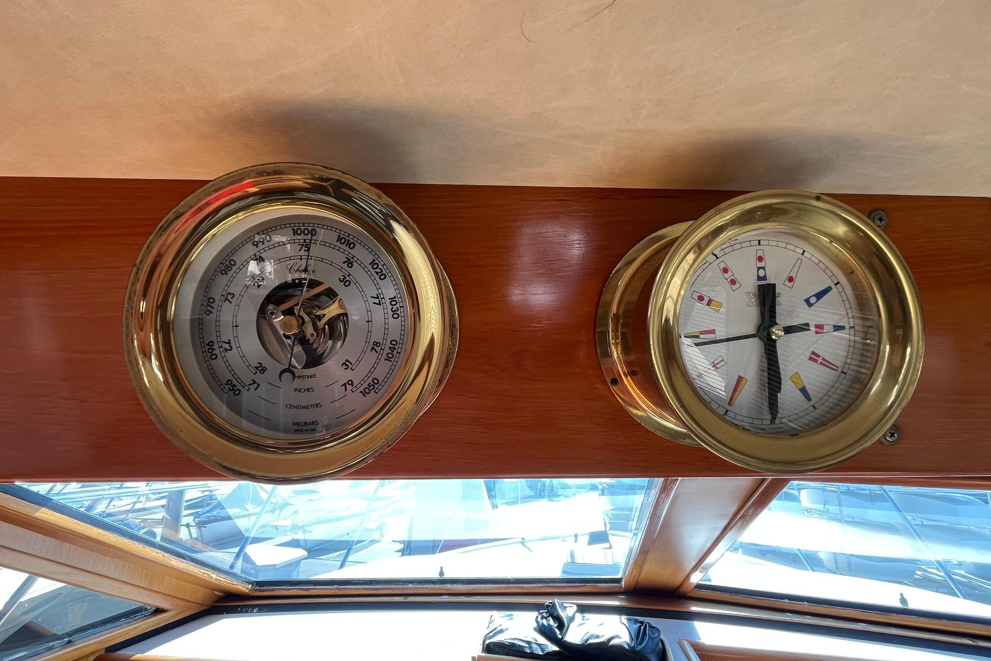 Brass nautical instruments on 1989 Ocean Alexander 440 Sundeck CPMY yacht interior.