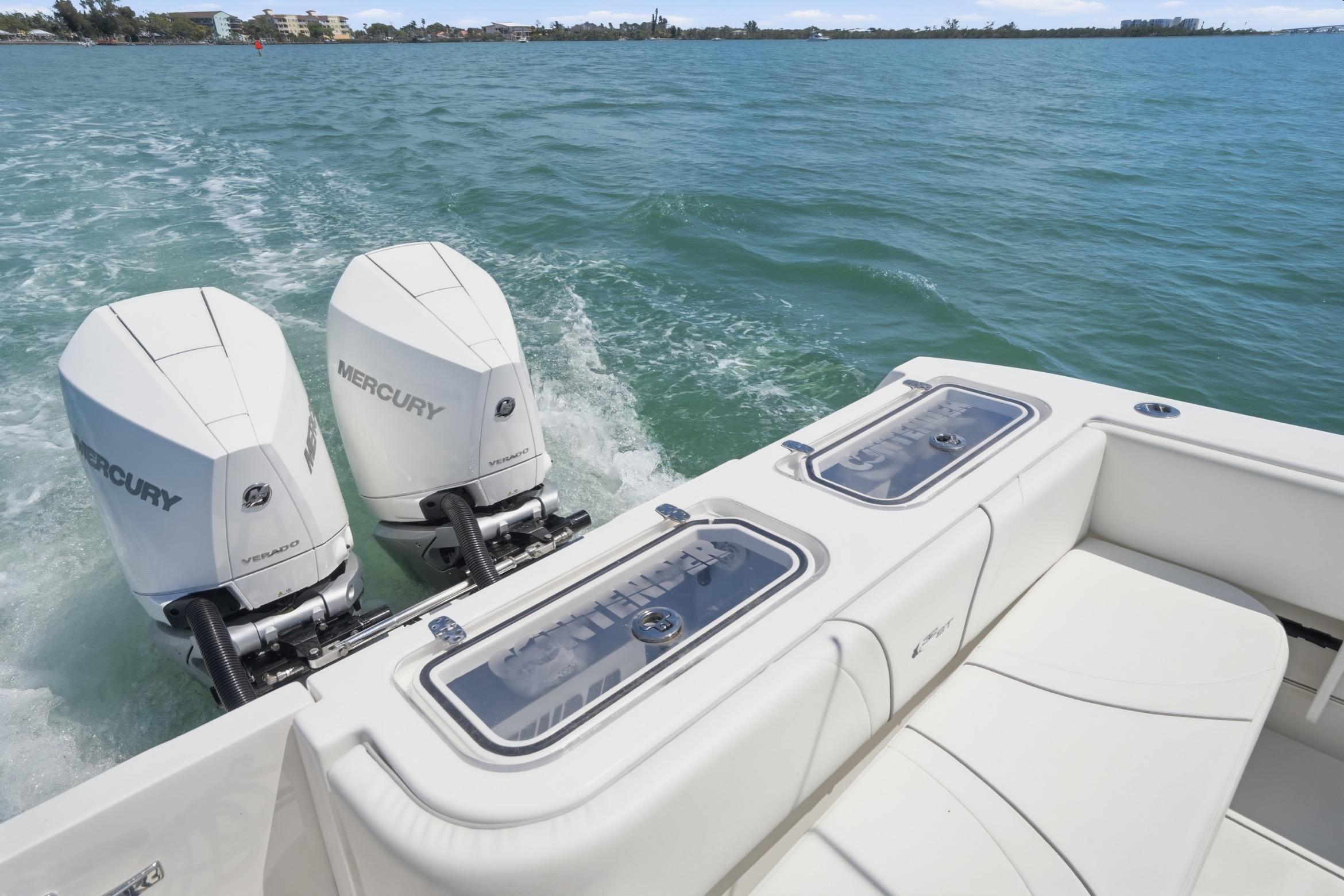 2024 Contender 32 ST boat with dual Mercury engines on open water.