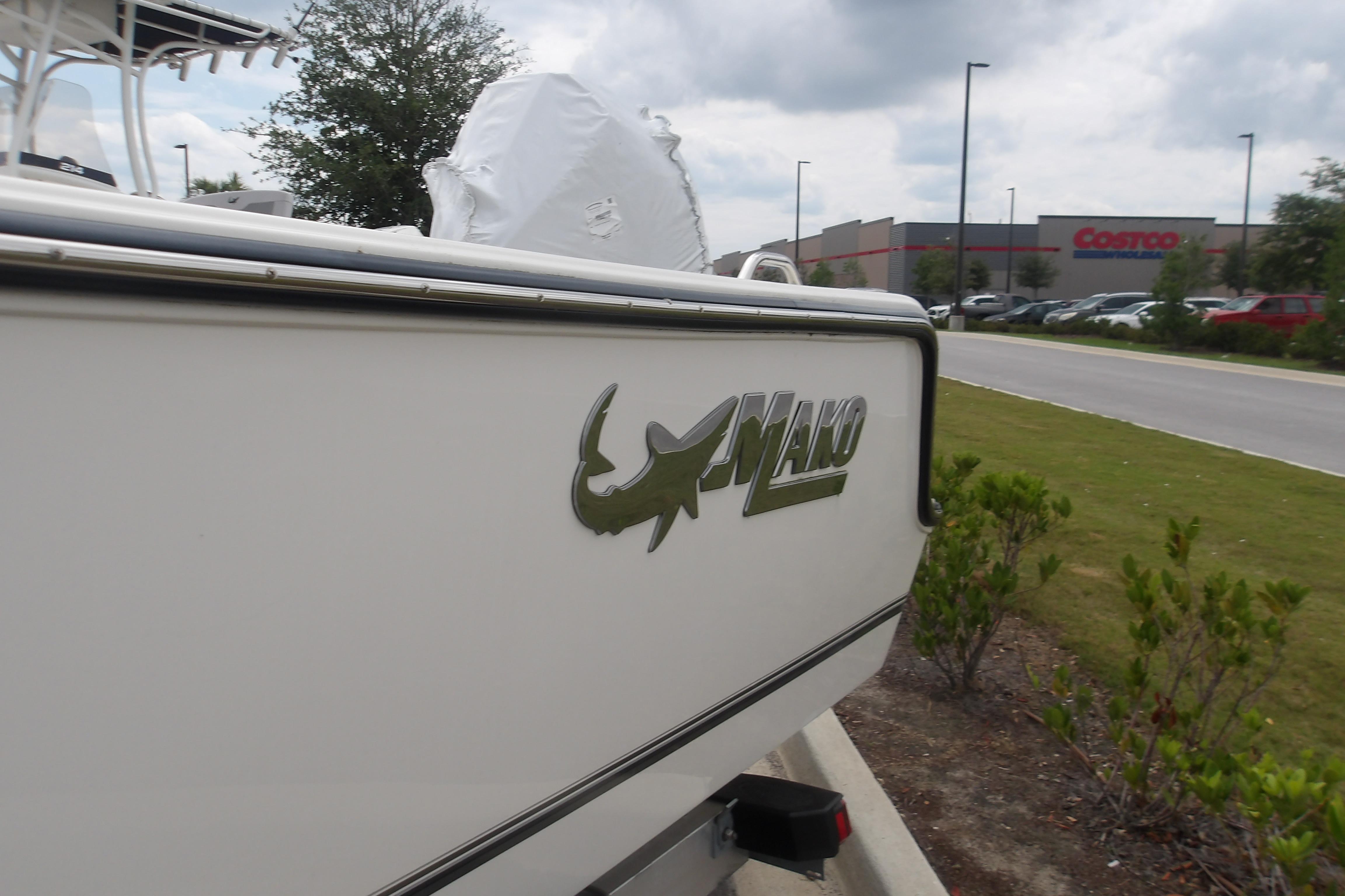 2025 Mako 214 Center Console boat parked near a Costco store.