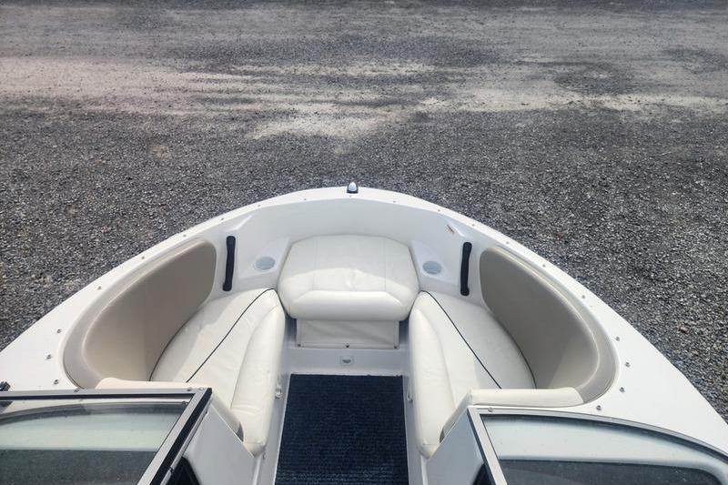 2012 Sea-Doo 180 Challenger boat interior with white seating and open bow design.