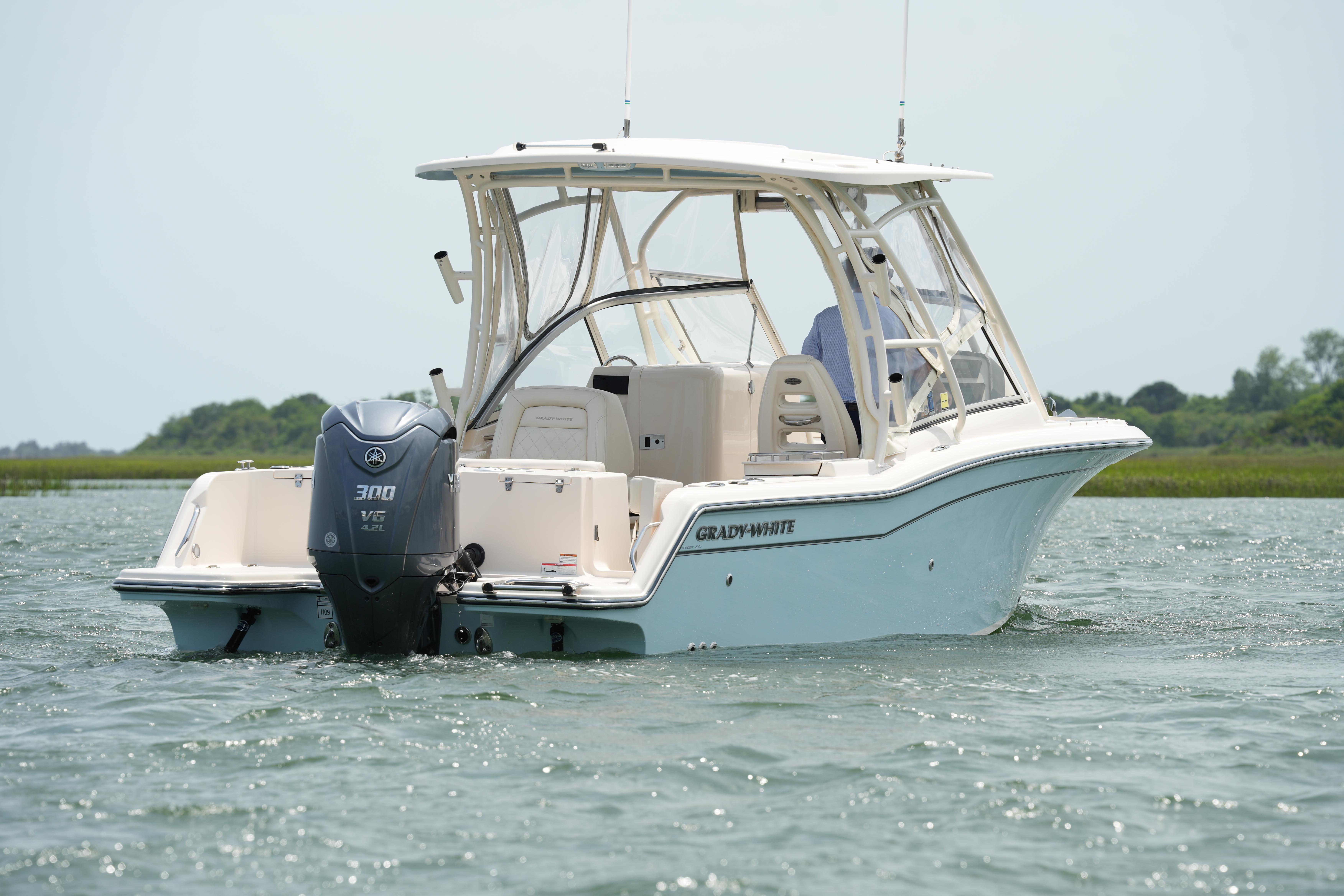 2021 Grady-White Freedom 235 boat on water, featuring Yamaha 300 V6 engine.