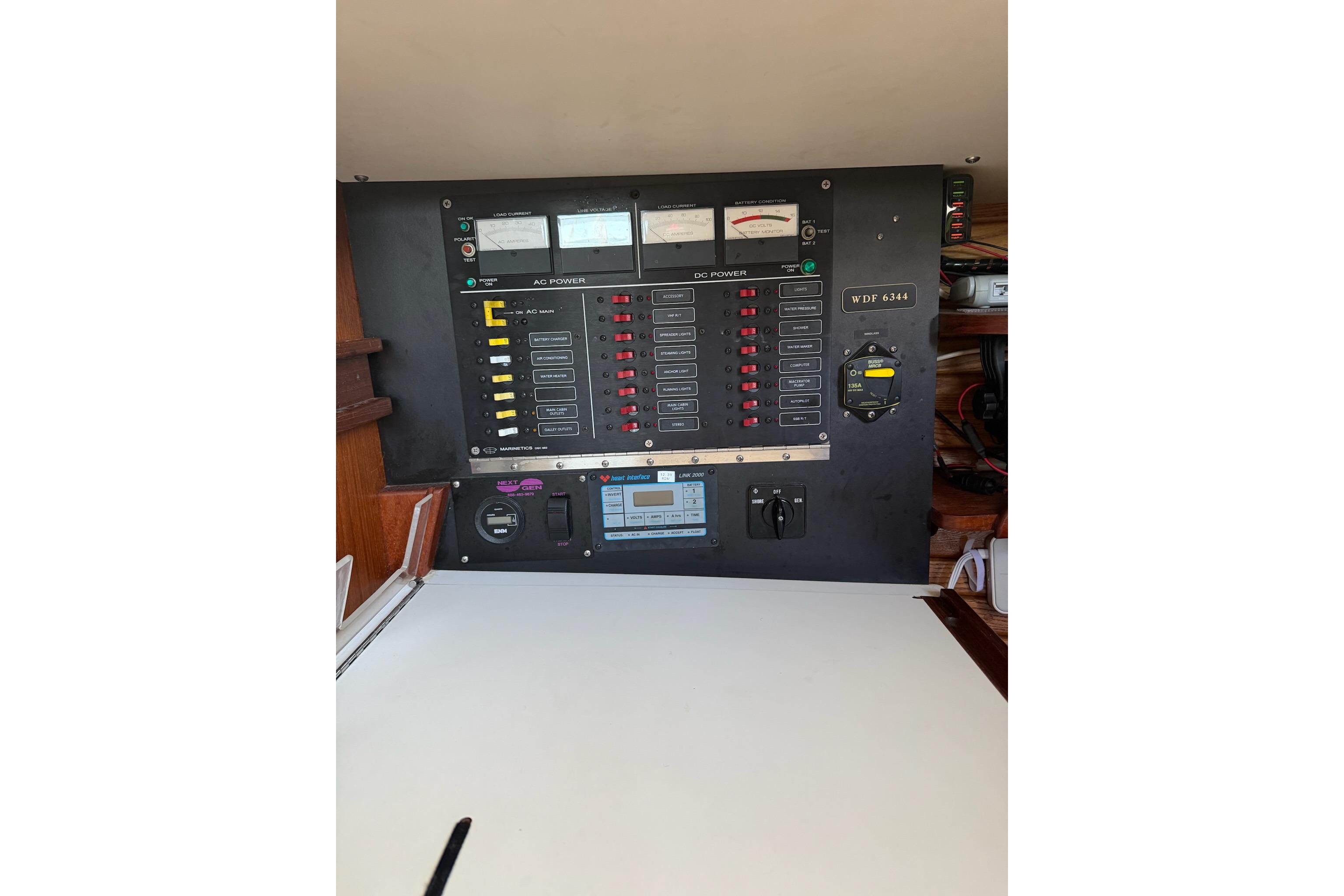 Control panel of a 1984 Morgan 384 sailboat, featuring various switches and gauges.