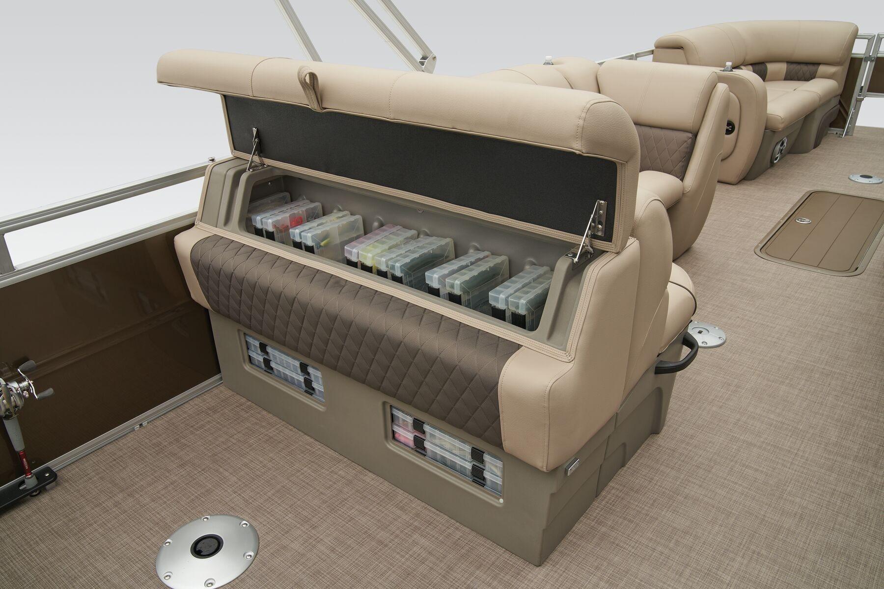 2023 Sun Tracker SportFish 22 XP3 boat interior with storage compartments and seating.