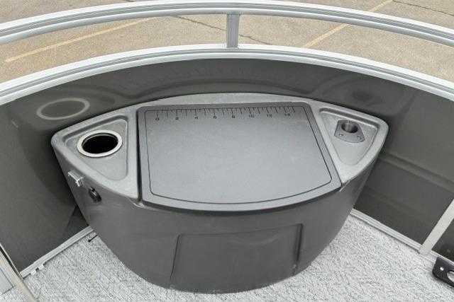 2026 Sun Tracker Fishin' Barge 22 DLX fishing station with cup holder and storage.