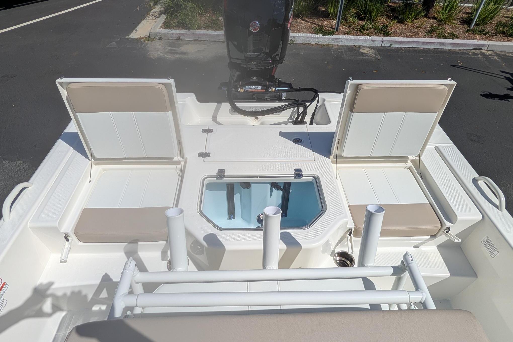 2026 Mako Pro Skiff 19 CC boat interior with seating and storage compartments.