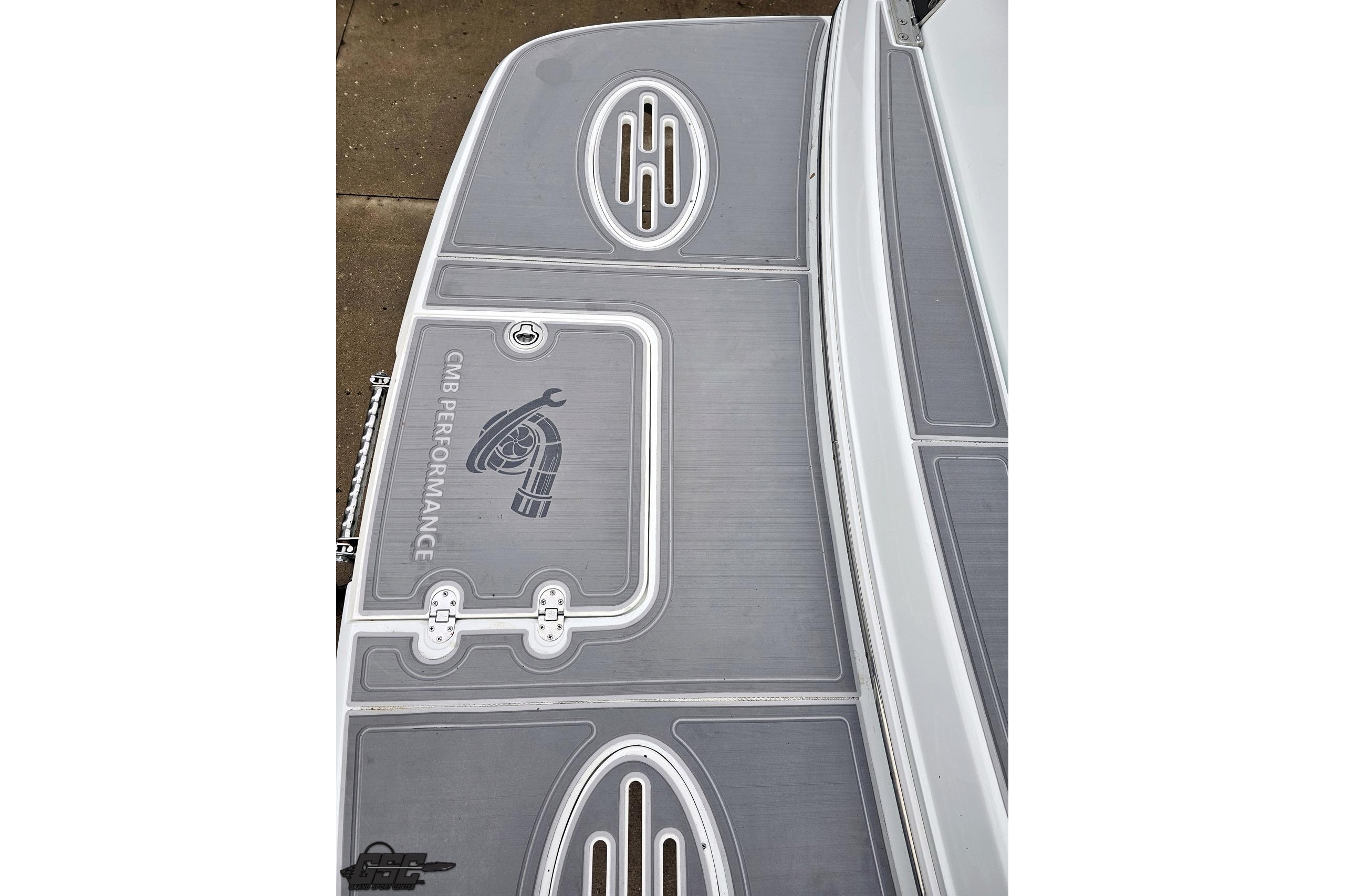 2008 Baja 335 Performance boat deck with CMB Performance logo and gray detailing.