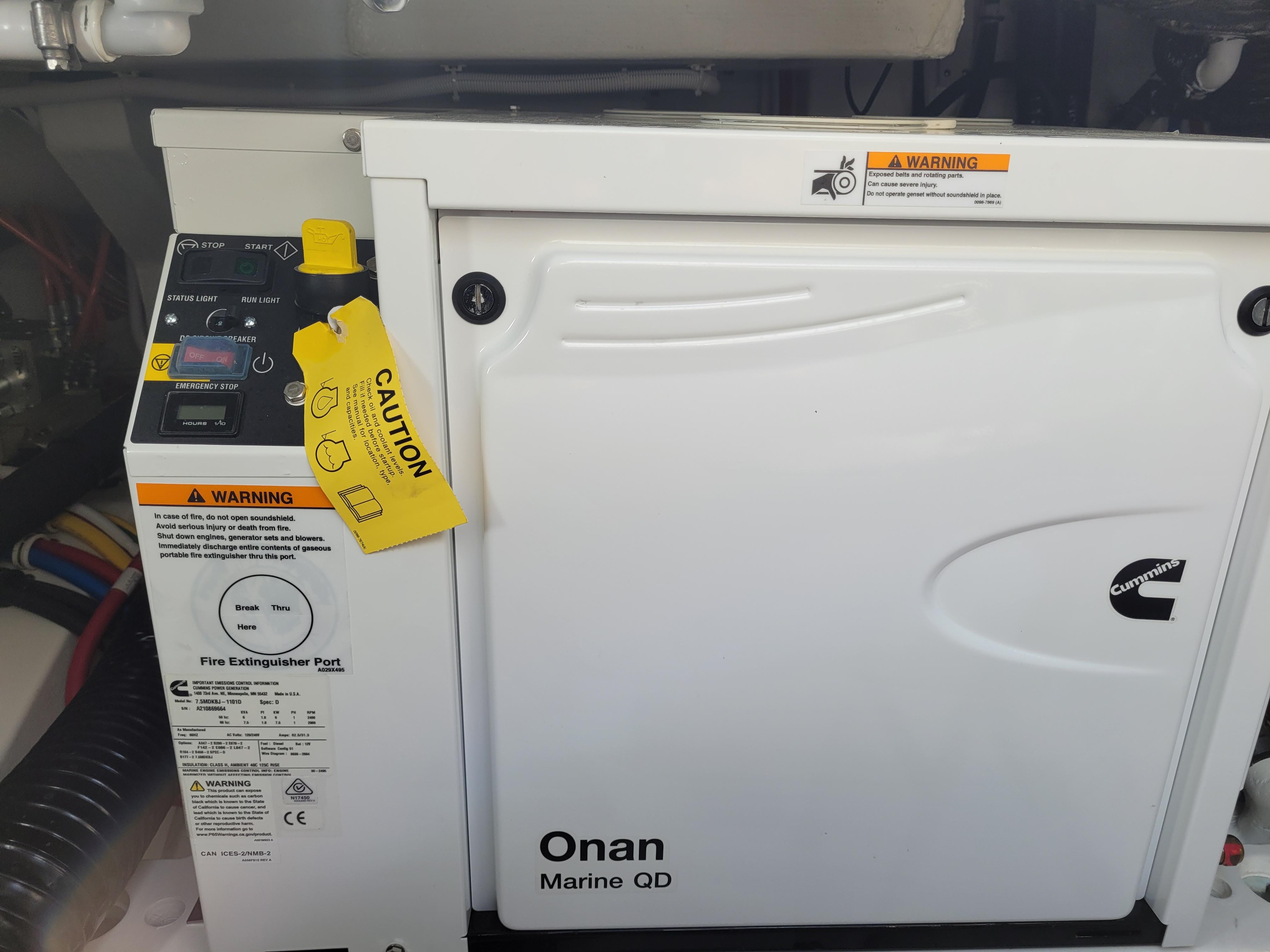 Onan Marine QD generator in a 2021 Tiara Sport 43LE boat engine room.