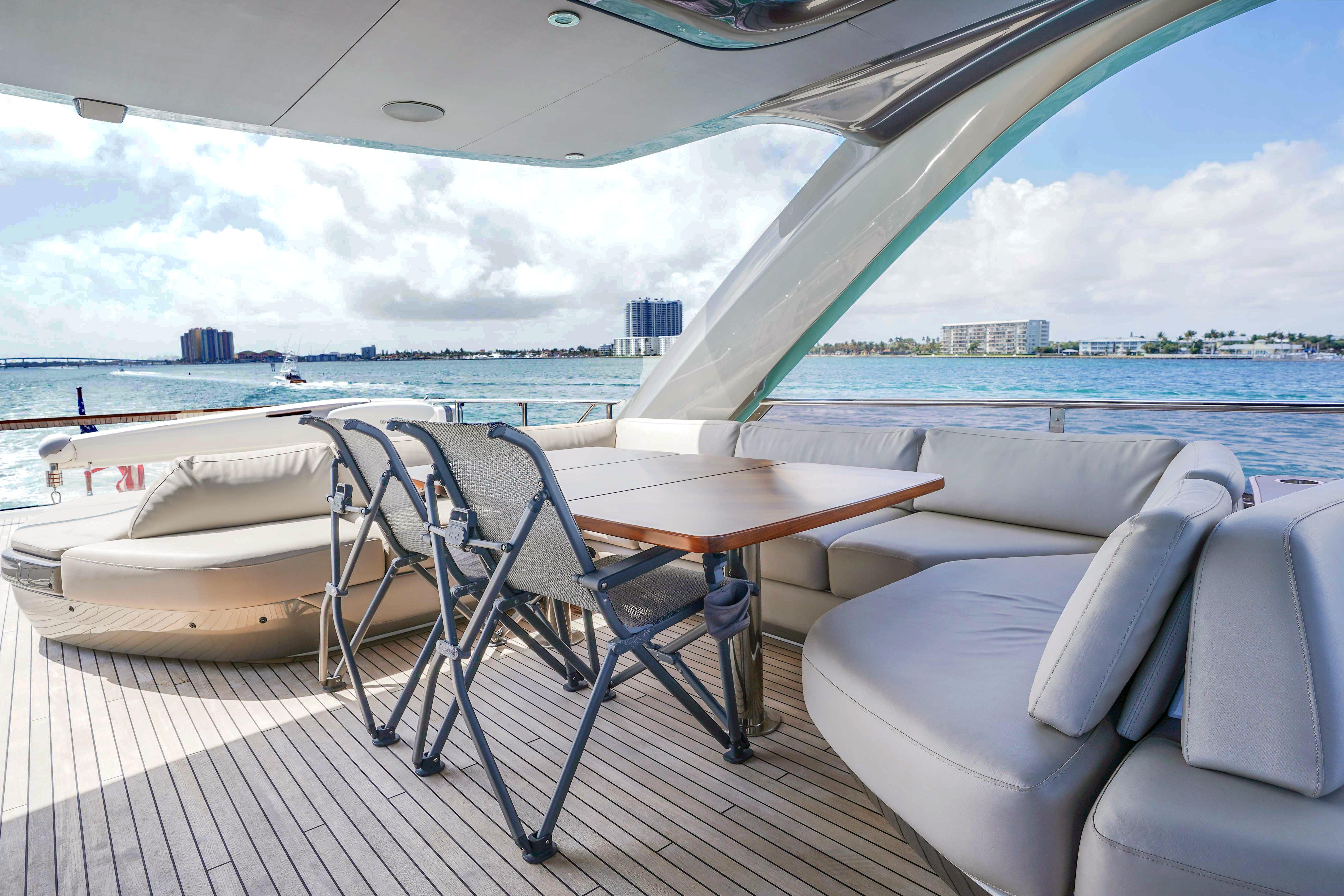 Luxurious 2021 Princess Y85 yacht deck with elegant seating and ocean view.