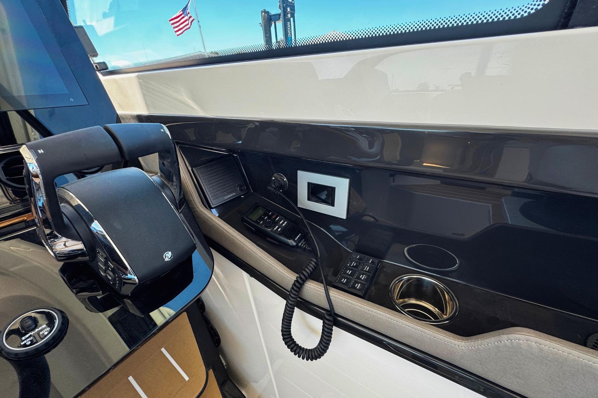 Interior view of 2027 Tiara Yachts 39 LE helm with controls and American flag visible.