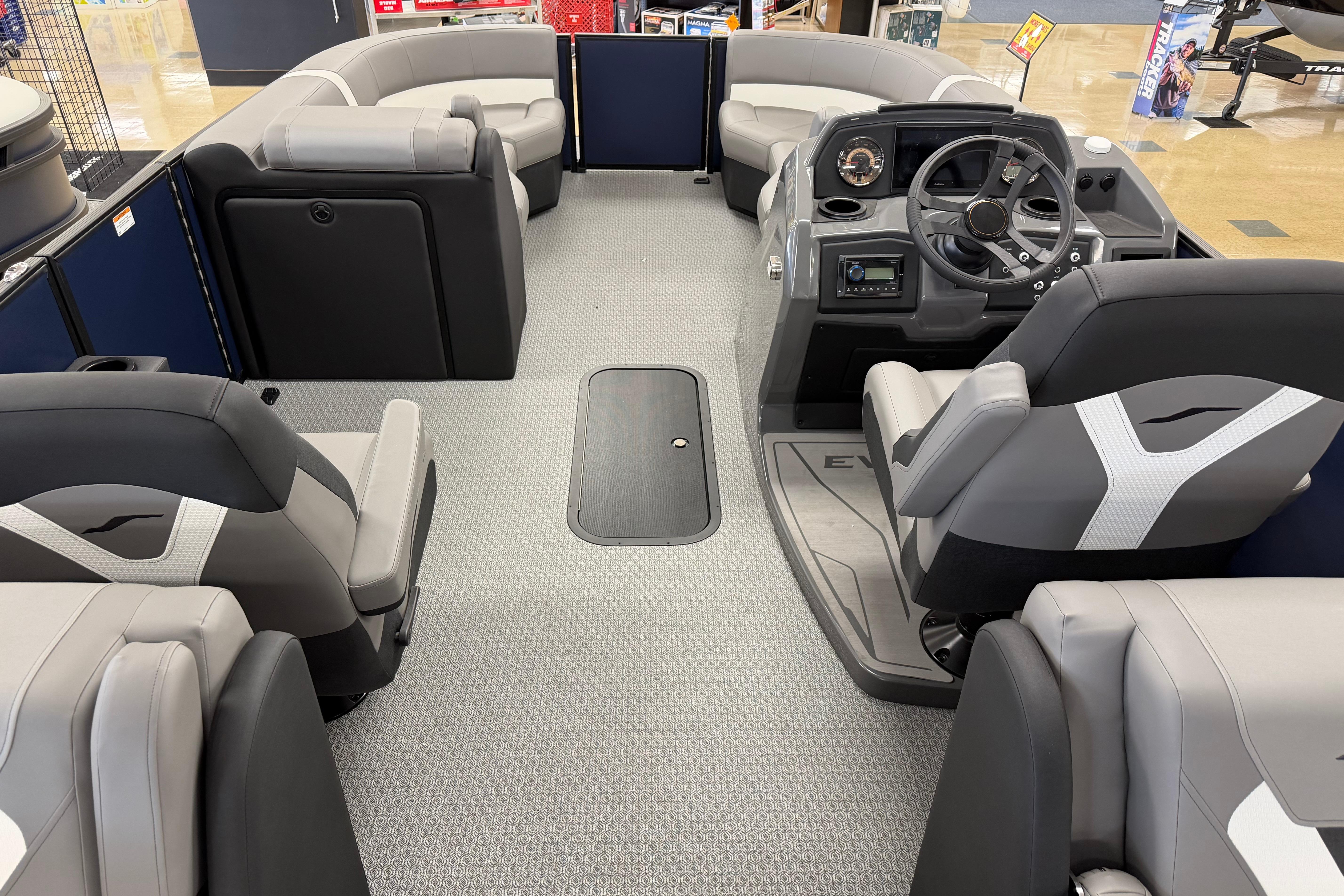 Interior of 2026 Evotti 523QL boat with modern seating and steering console.