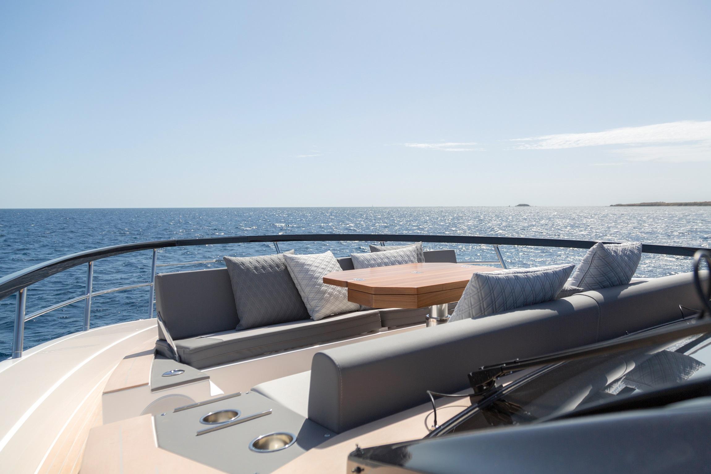 Luxurious 2025 Astondoa 677 Coupe yacht deck with ocean view and elegant seating area.