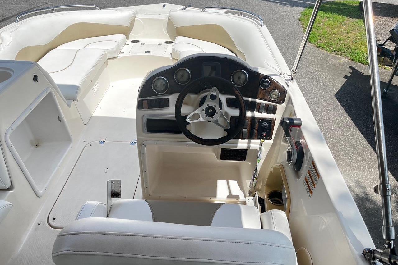 Interior view of a 2008 Hurricane FD202 boat, featuring a sleek steering console.