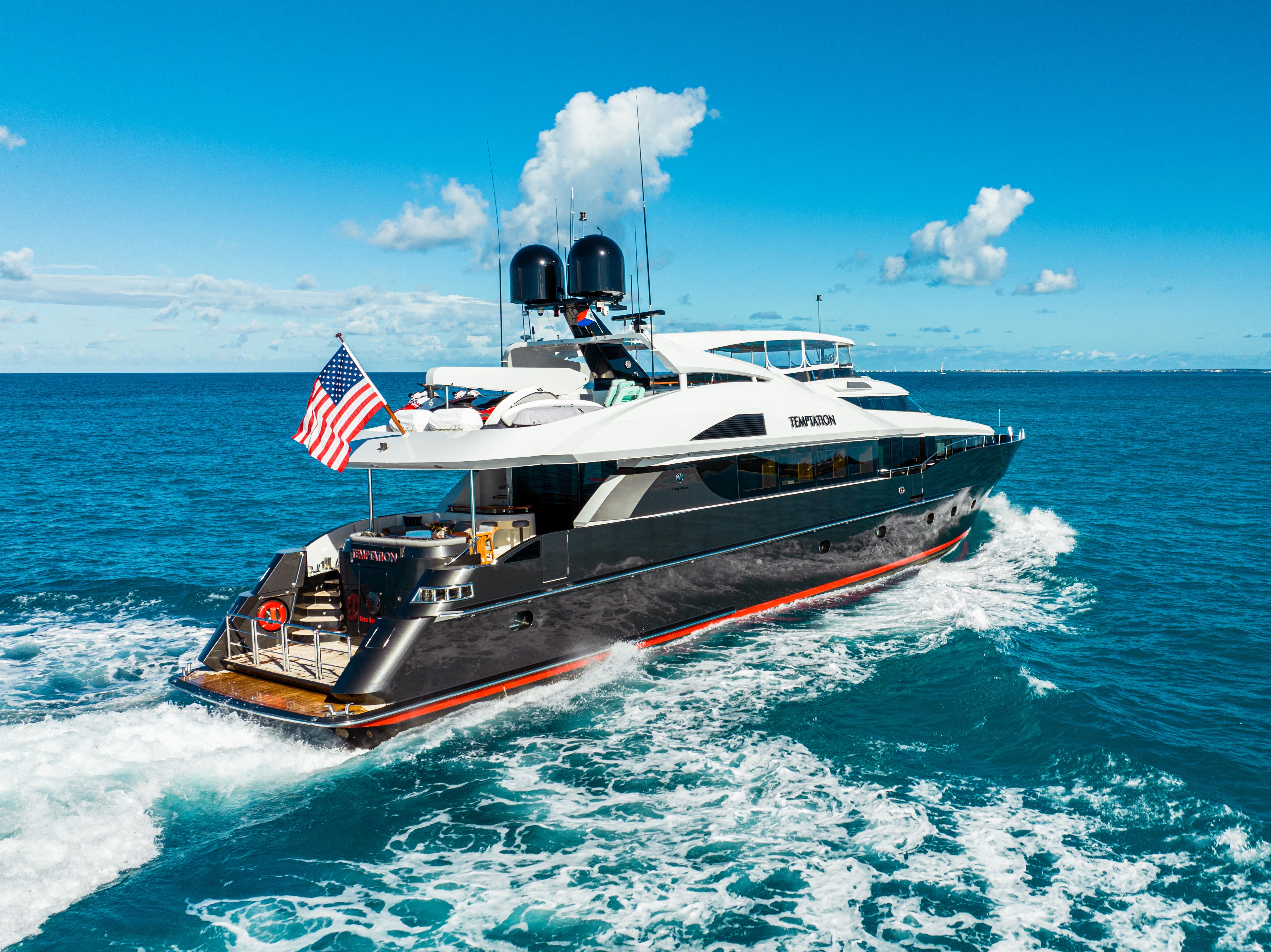 A luxurious 2005 Palmer Johnson yacht cruising on open water.