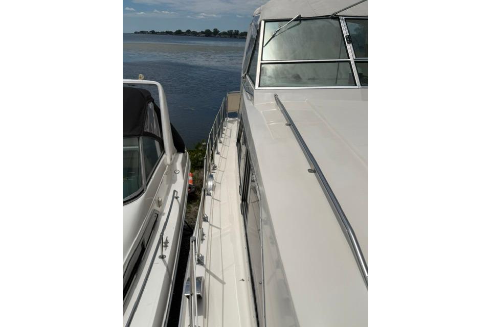 1980 Chris-Craft 381 Catalina yacht docked by the water.