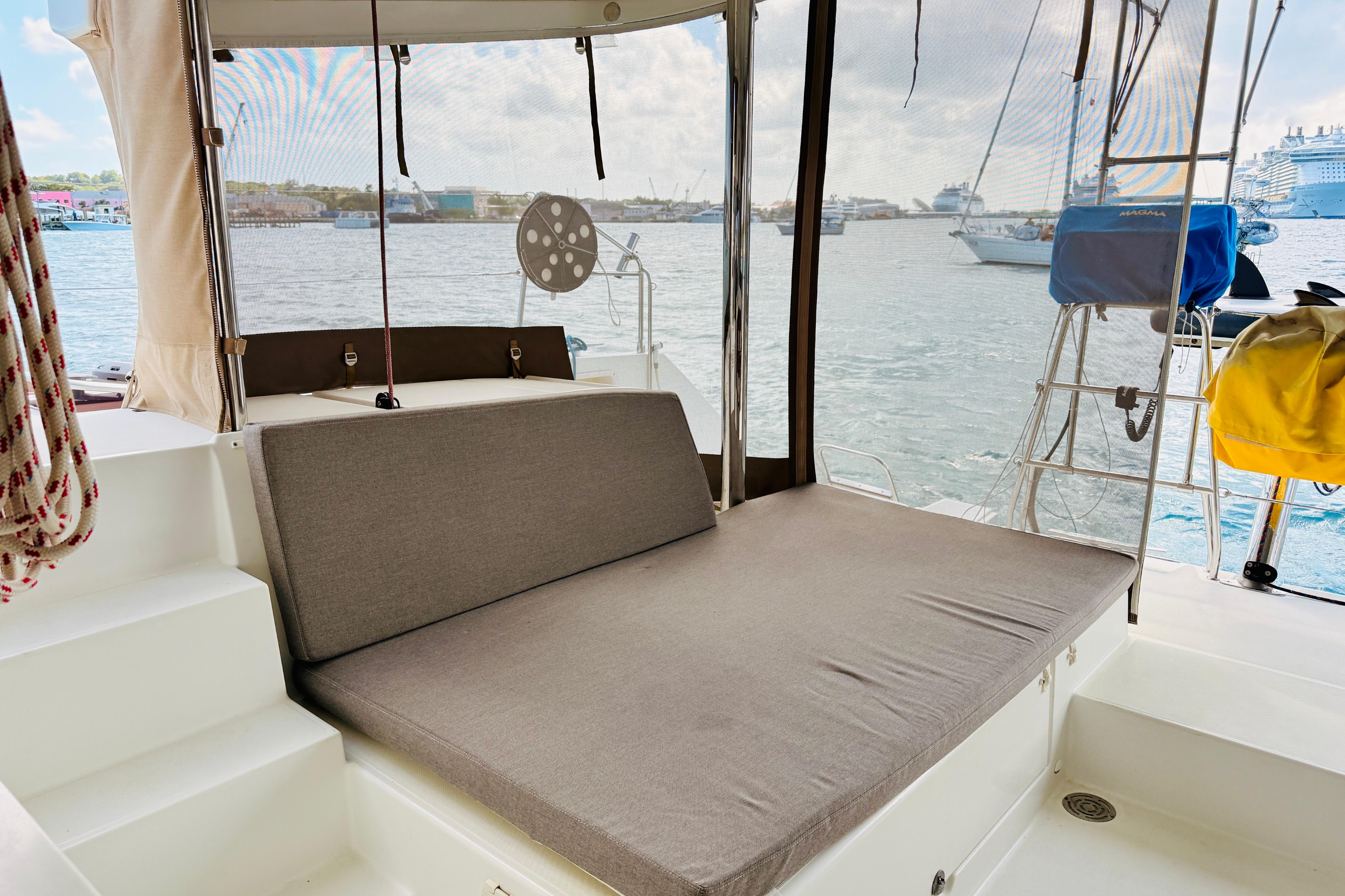 Lagoon 450 F 2012 yacht deck with seating area overlooking marina.