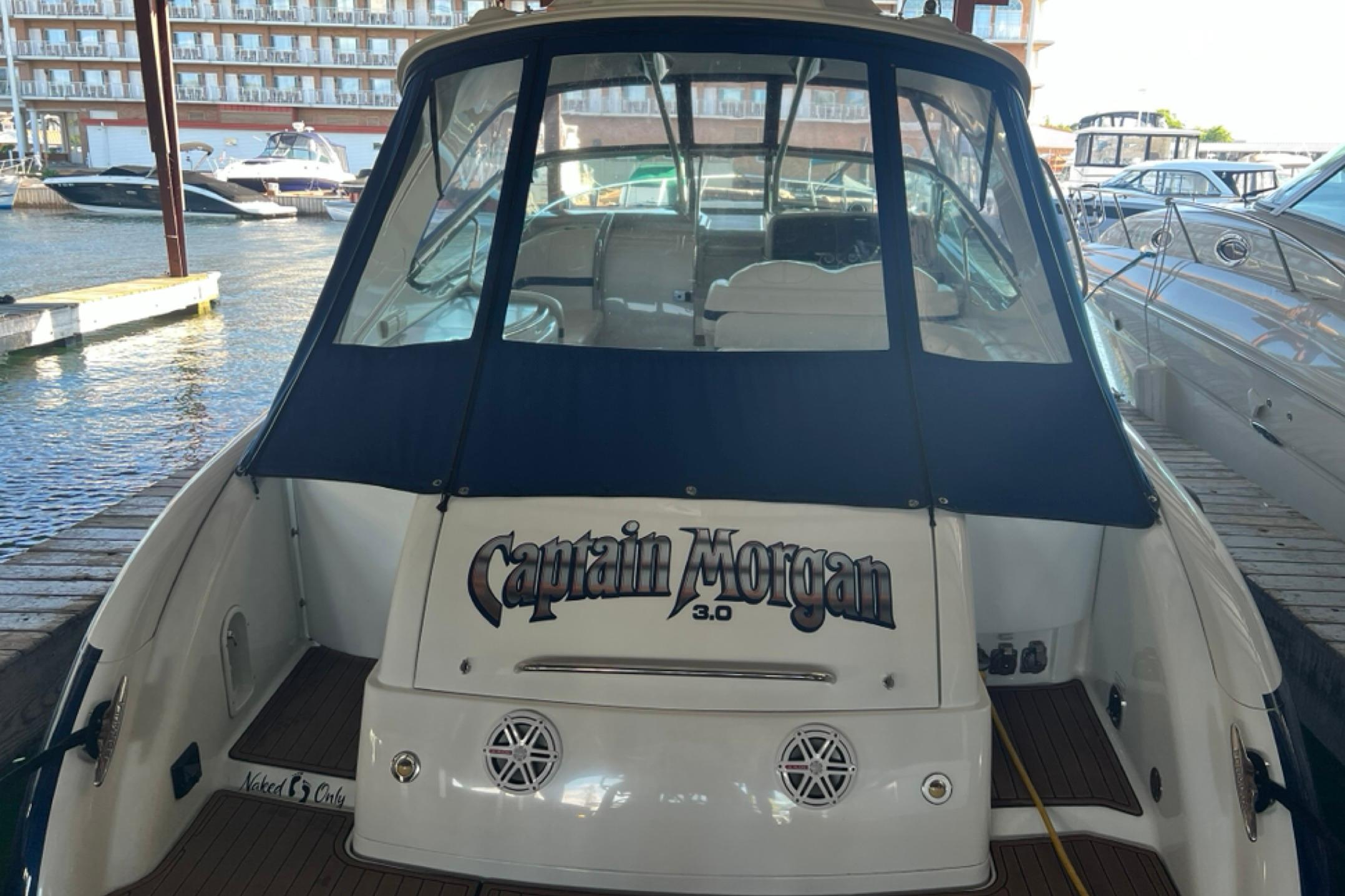 2008 Formula 400 Super Sport boat docked, featuring "Captain Morgan" branding on the stern.
