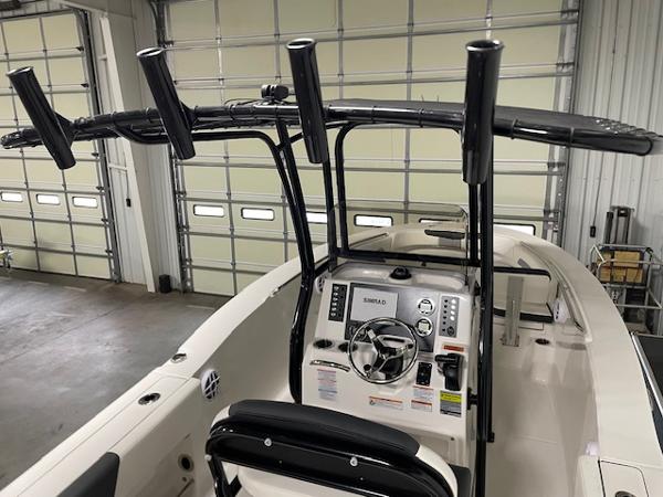 2025 Robalo R202 Explorer boat interior with steering console and rod holders.